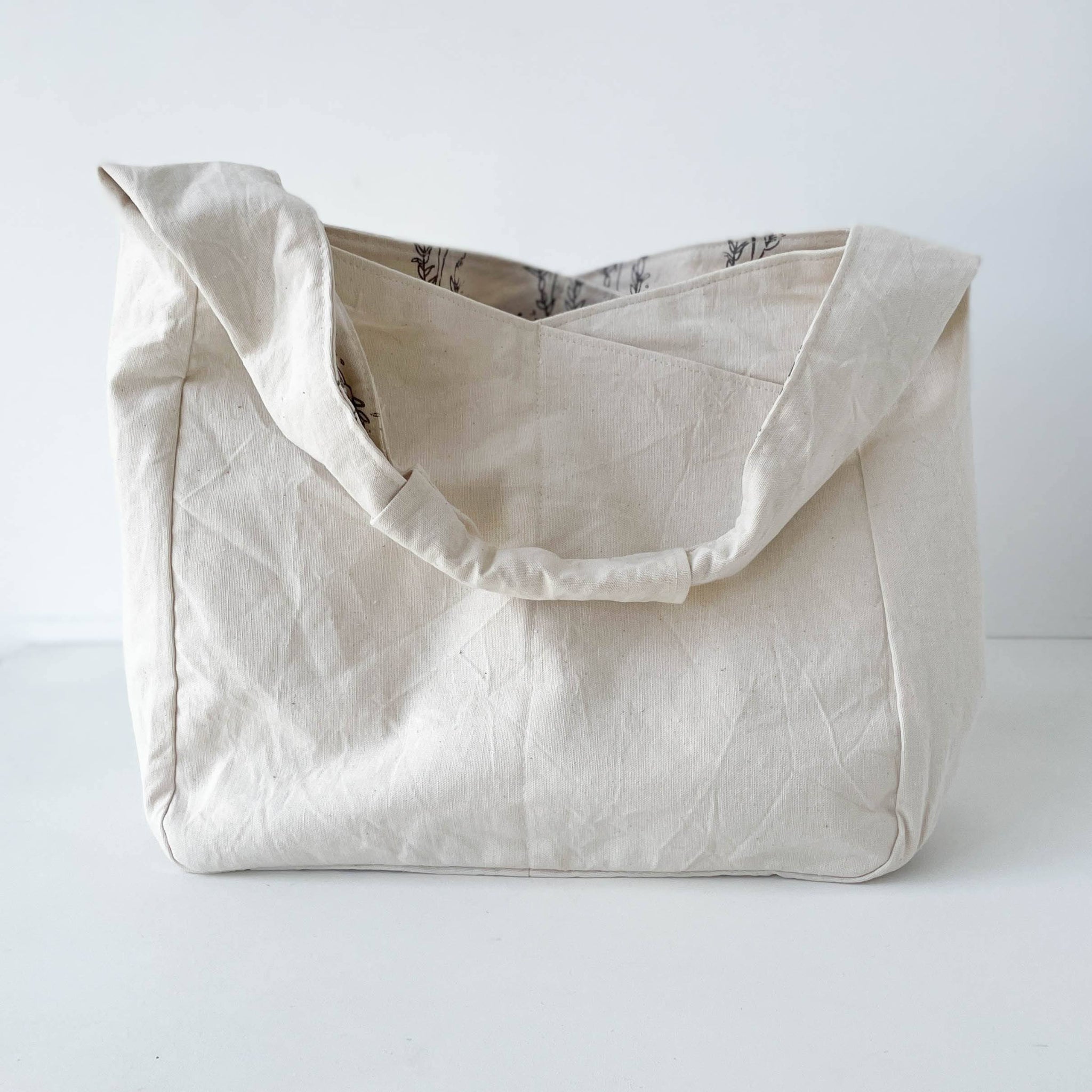 Beige hobo bag on a white background
