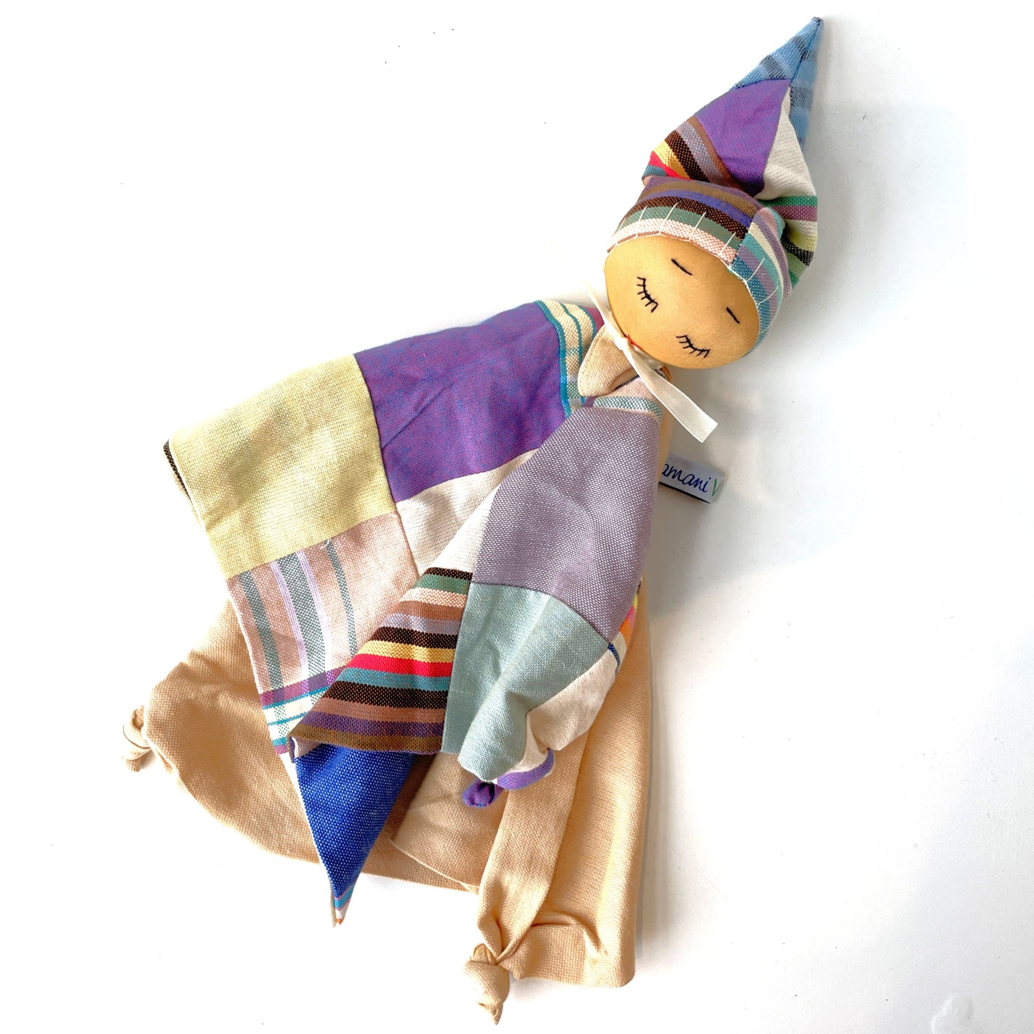 Colorful fabric doll on a white background