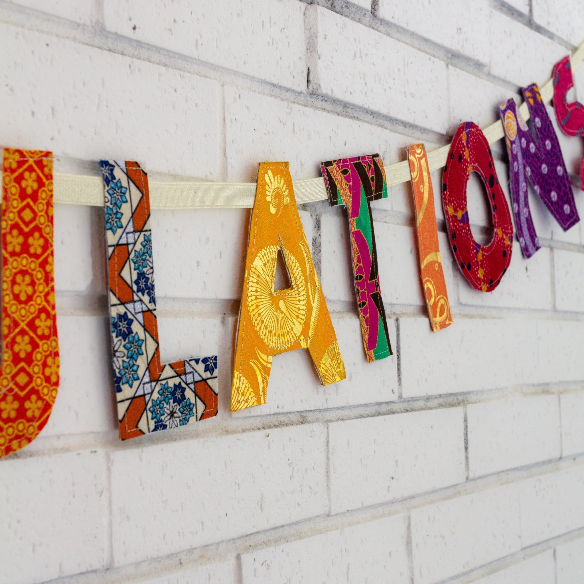 Handmade Congratulations Garland stitched by the women of Amani Kenya