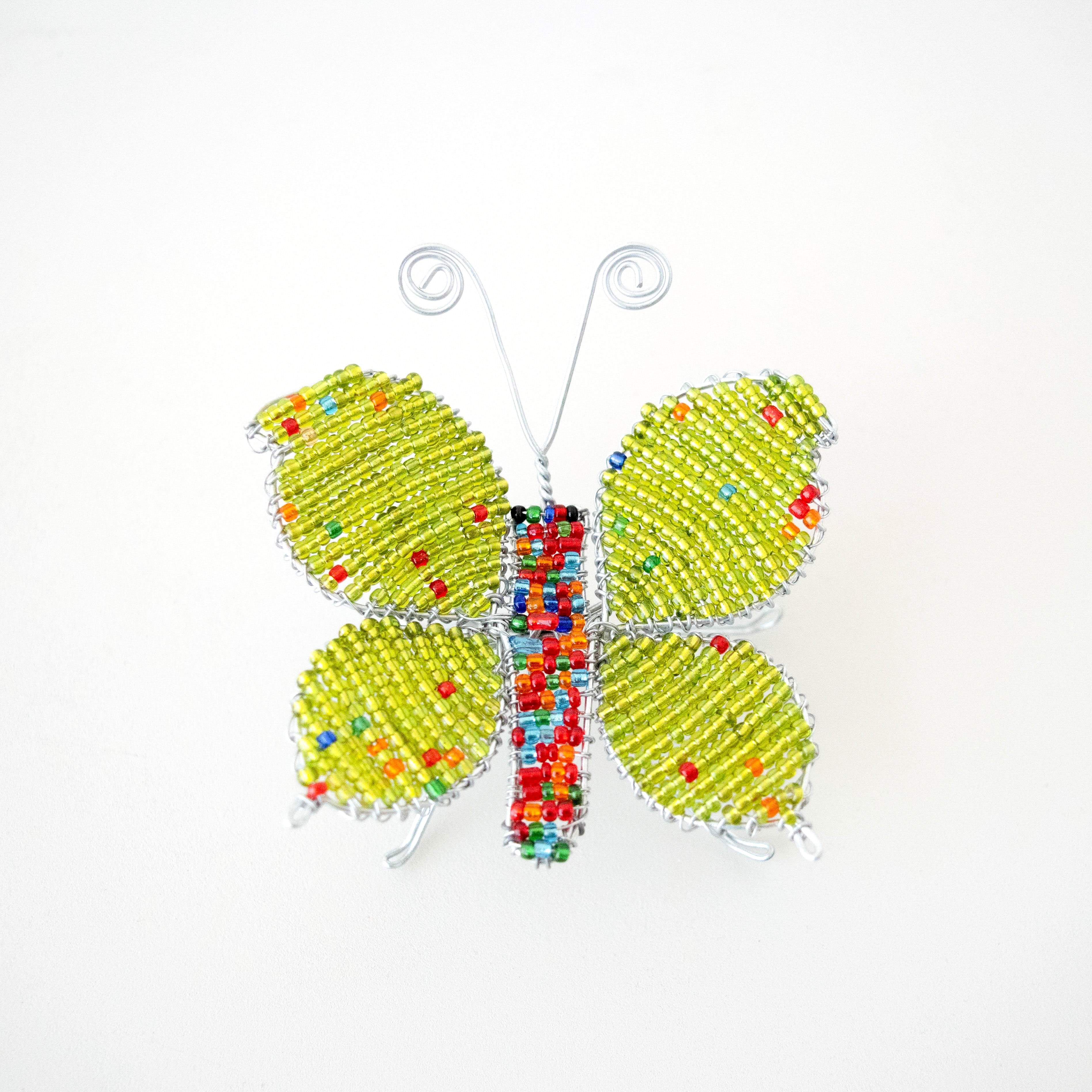 Decorative butterfly with colorful beads on a white background