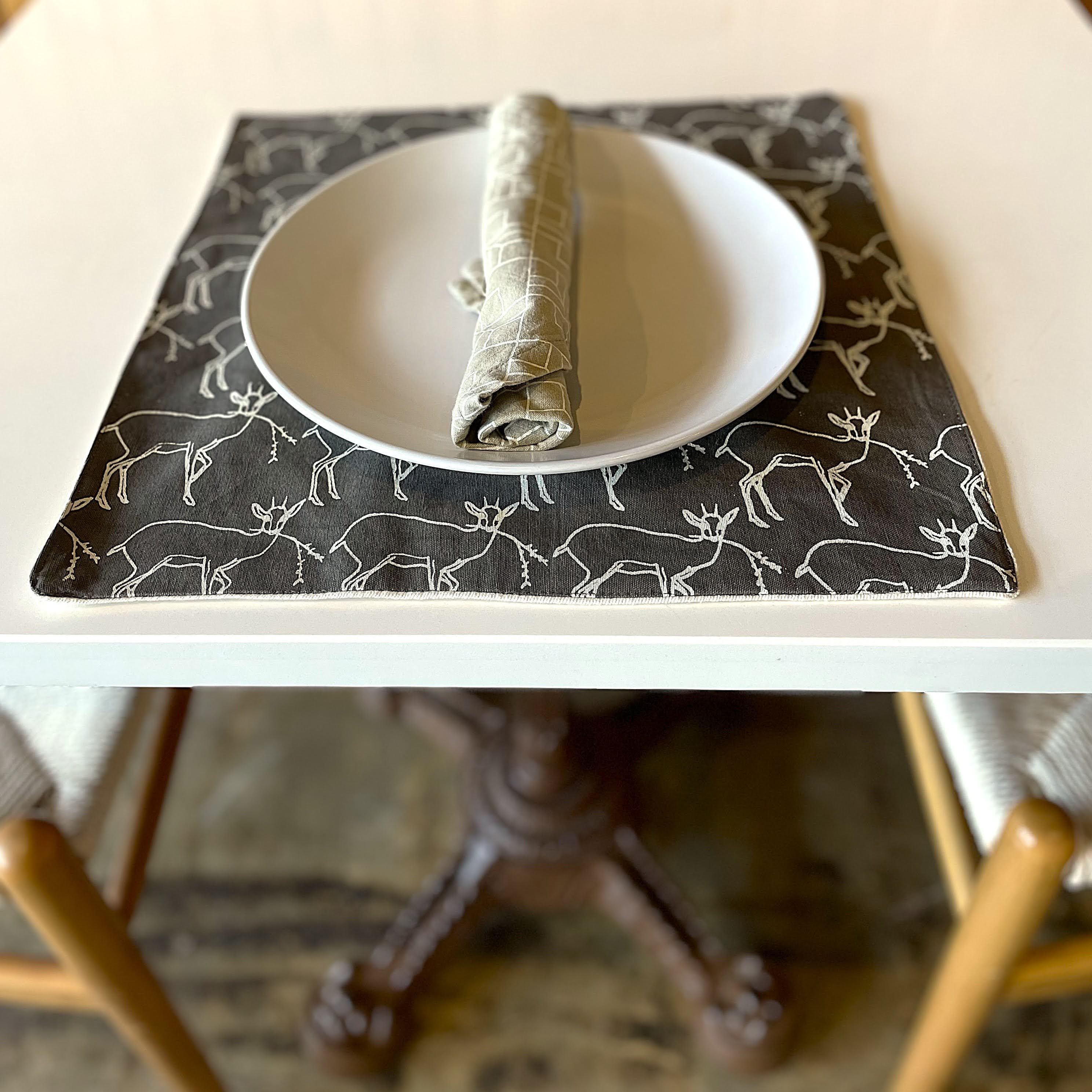 Placemat with deer pattern on a table setting