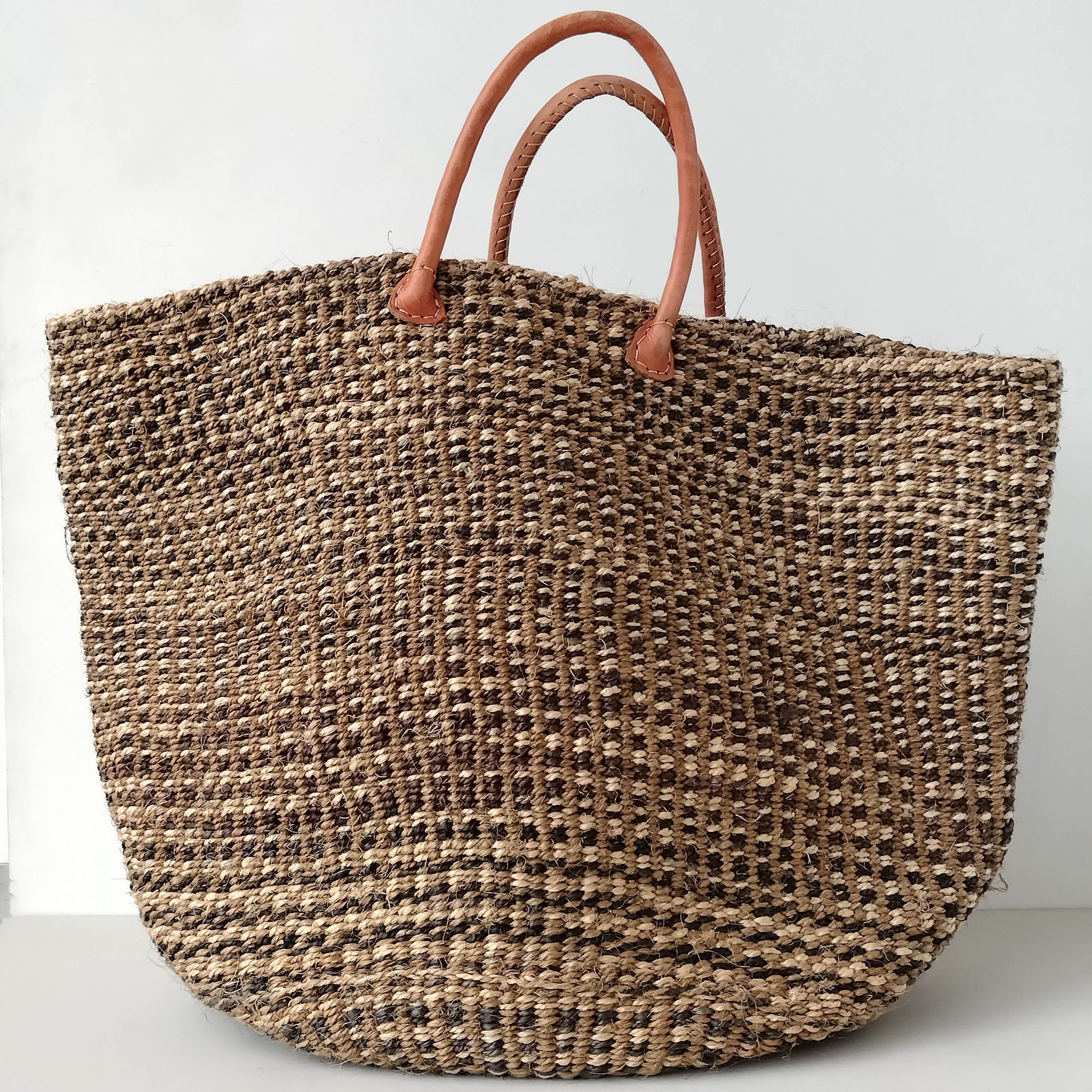 A fair trade handwoven sisal basket made by Kenyan artisans for a social enterprise