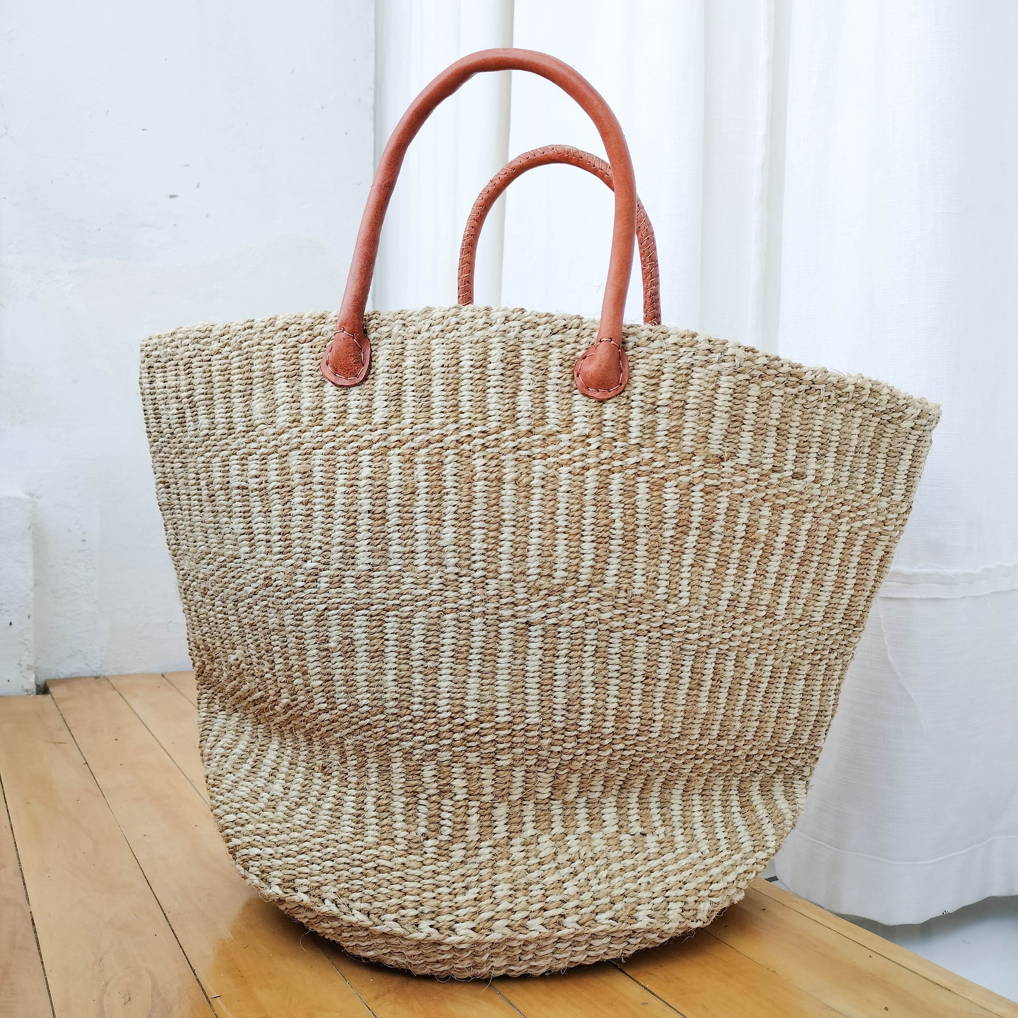 A Fair Trade handwoven sisal basket made by Kenyan artisans