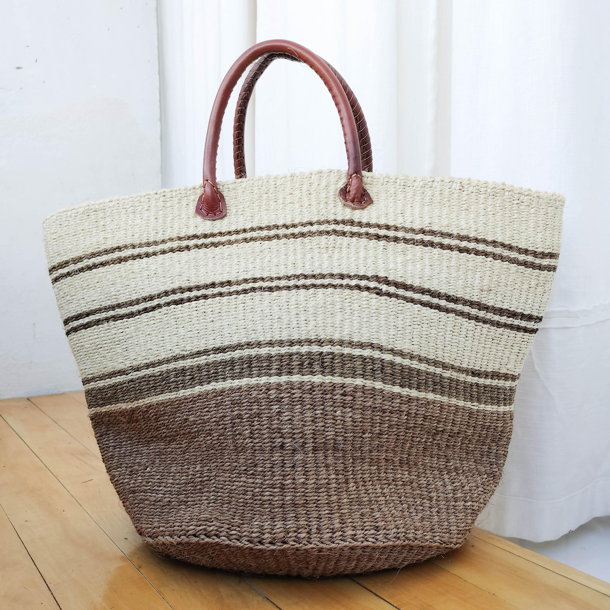 A fair trade handwoven sisal basket made by Kenyan artisans for a social enterprise