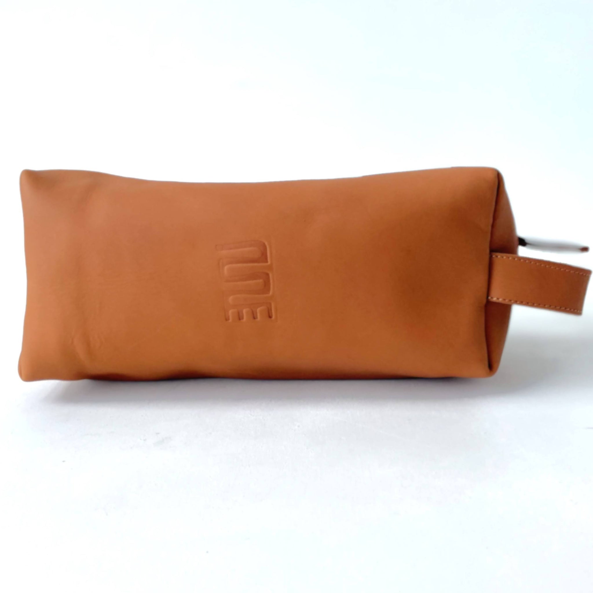 Brown leather travel case with a brand logo on a white background