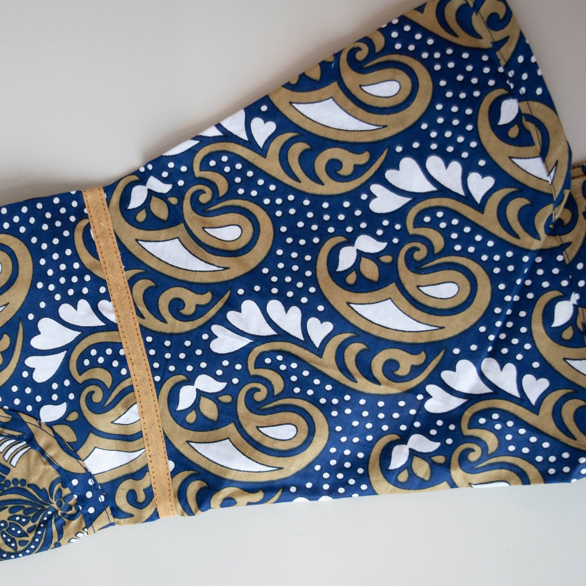 Kanga apron handmade by the women of Amani ya Juu in Kenya for a fair trade social enterprise