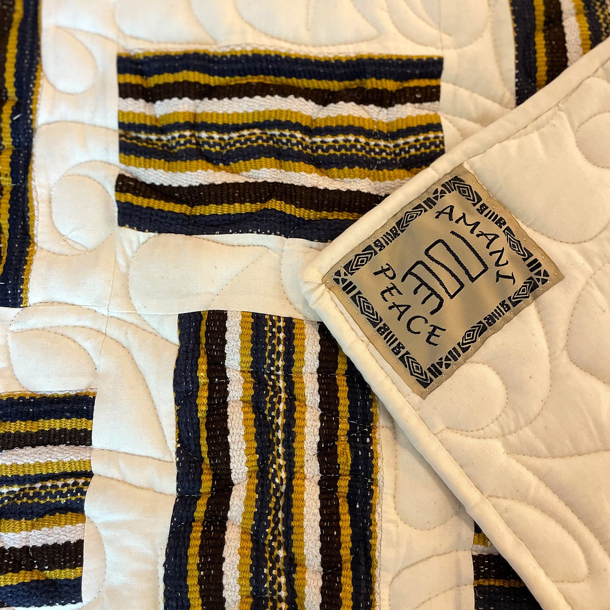 An Amani quilt - handstitched by the women at Amani Kenya for a Fair Trade social enterprise