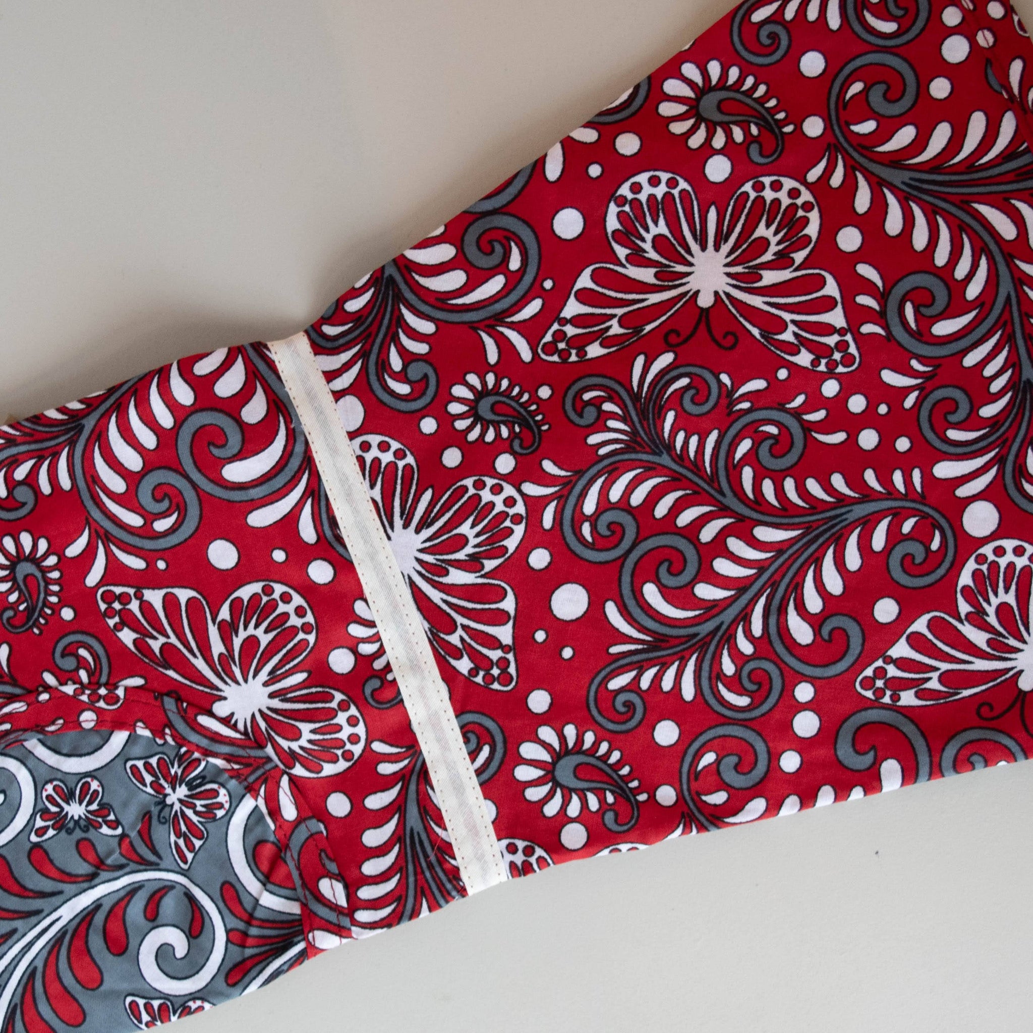 Kanga apron handmade by the women of Amani ya Juu in Kenya for a fair trade social enterprise