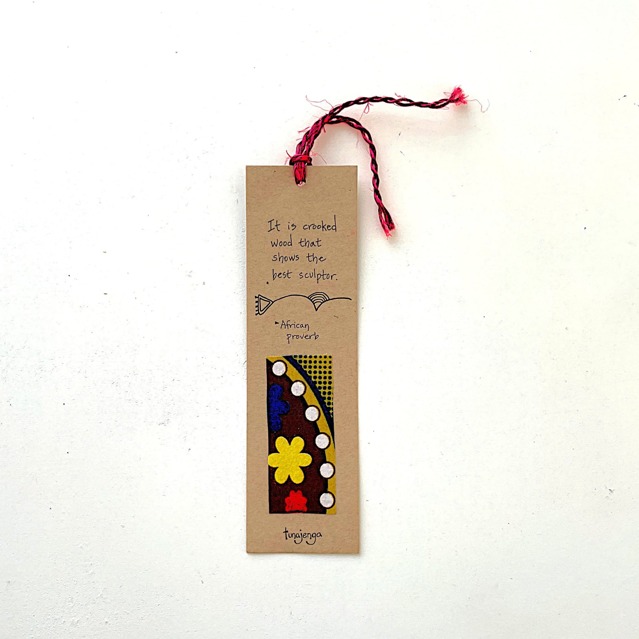 Bookmark with decorative design and text on a white background