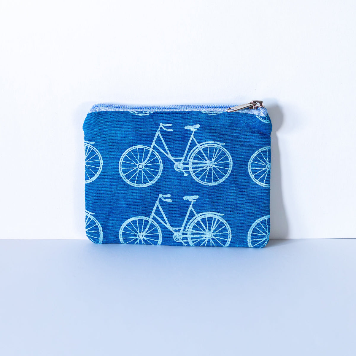 Blue bicycle coin purse on a white background