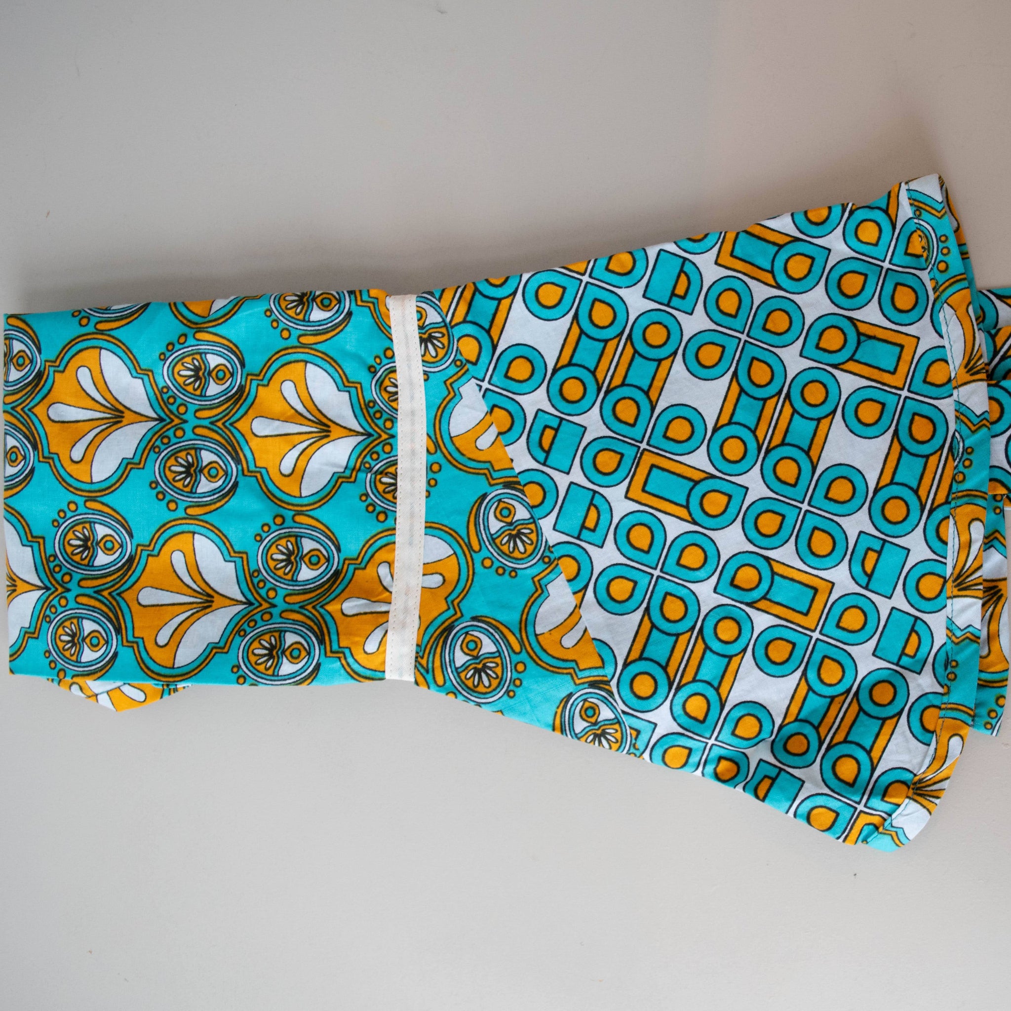 Kanga apron handmade by the women of Amani ya Juu in Kenya for a fair trade social enterprise