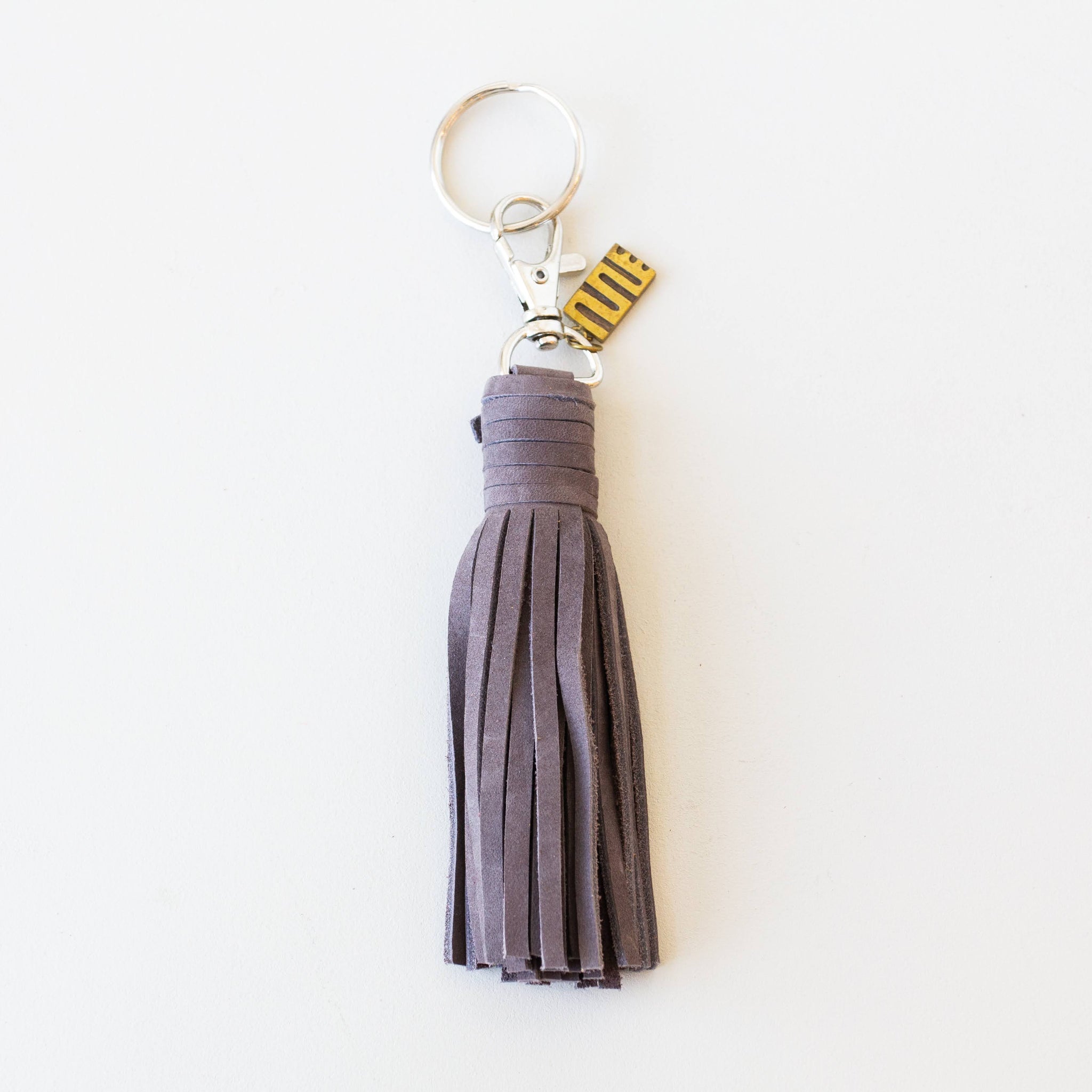 Gray tassel keychain on a white background
