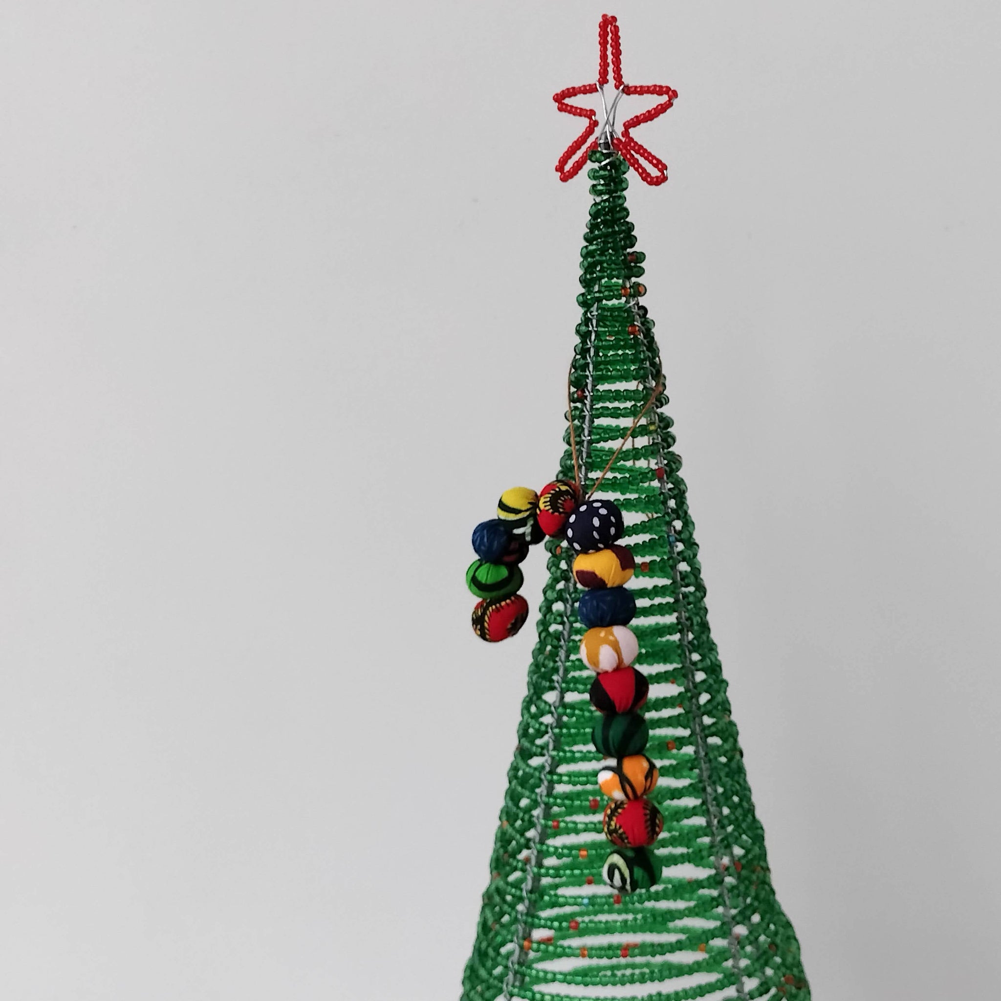 Kitenge ball candy cane ornament - handmade using local kitenge fabric by the Amani women of Uganda for a social enterprise
