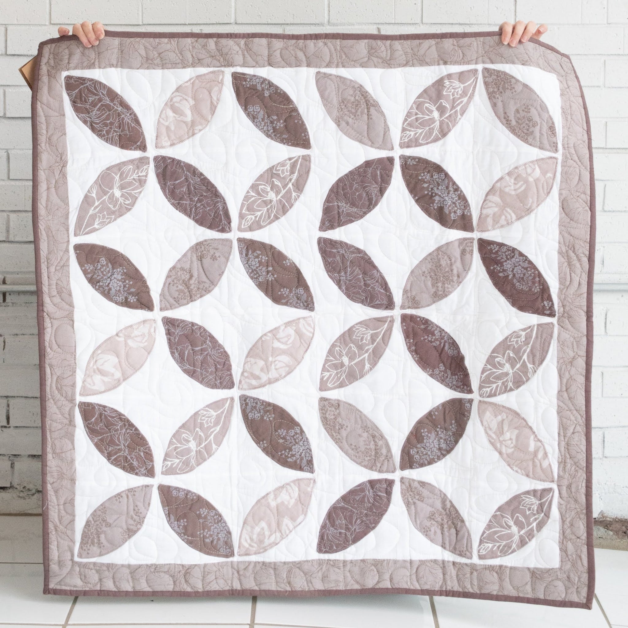 Hand stitched, hand dyed fabrics pieced together for an Amani ya Juu baby quilt