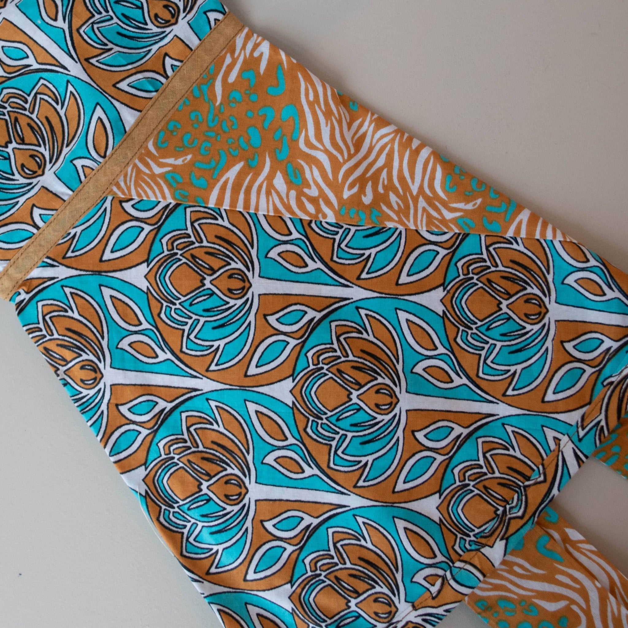 Kanga apron handmade by the women of Amani ya Juu in Kenya for a fair trade social enterprise