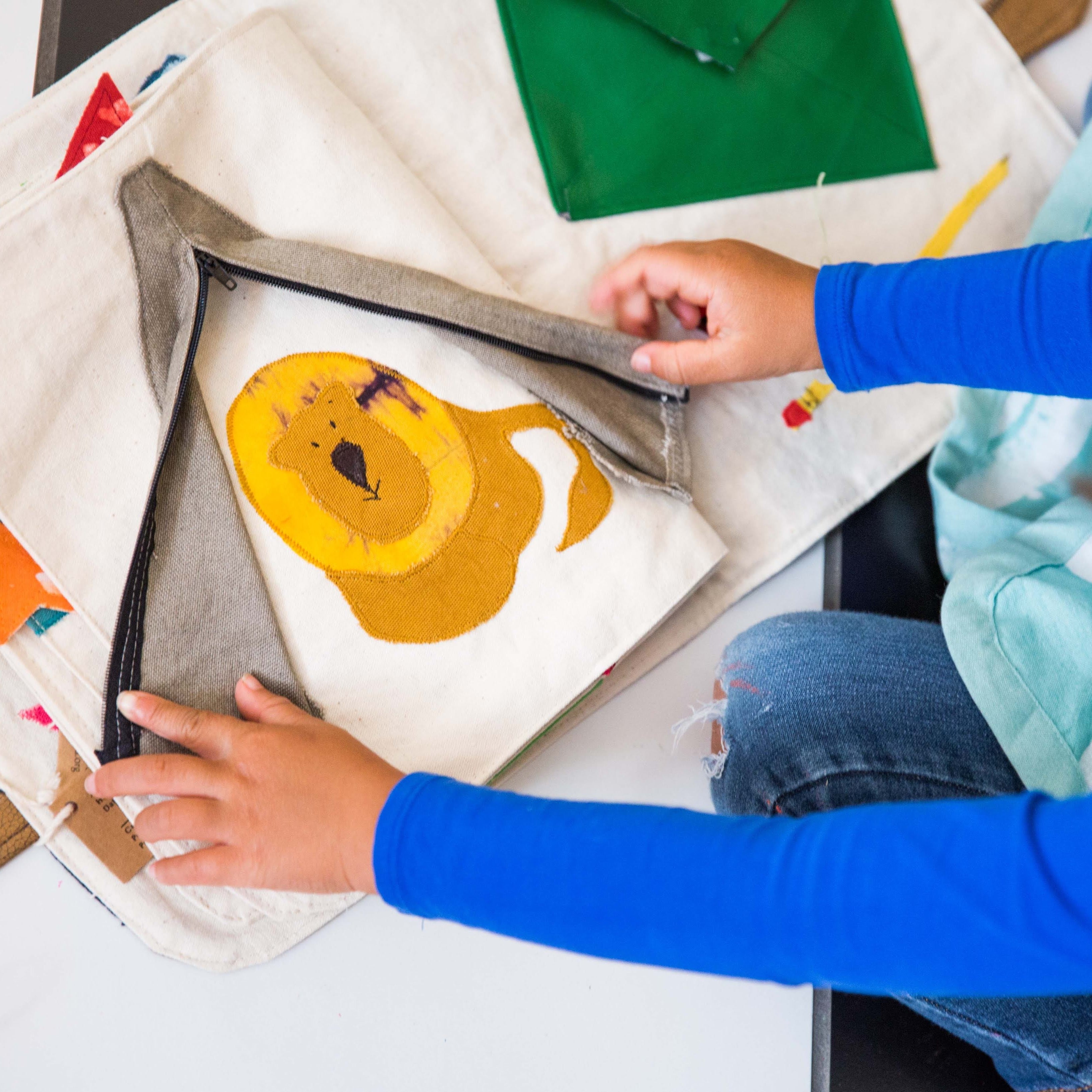 Busy Book - Kenyan materials and design for a fair trade boutique