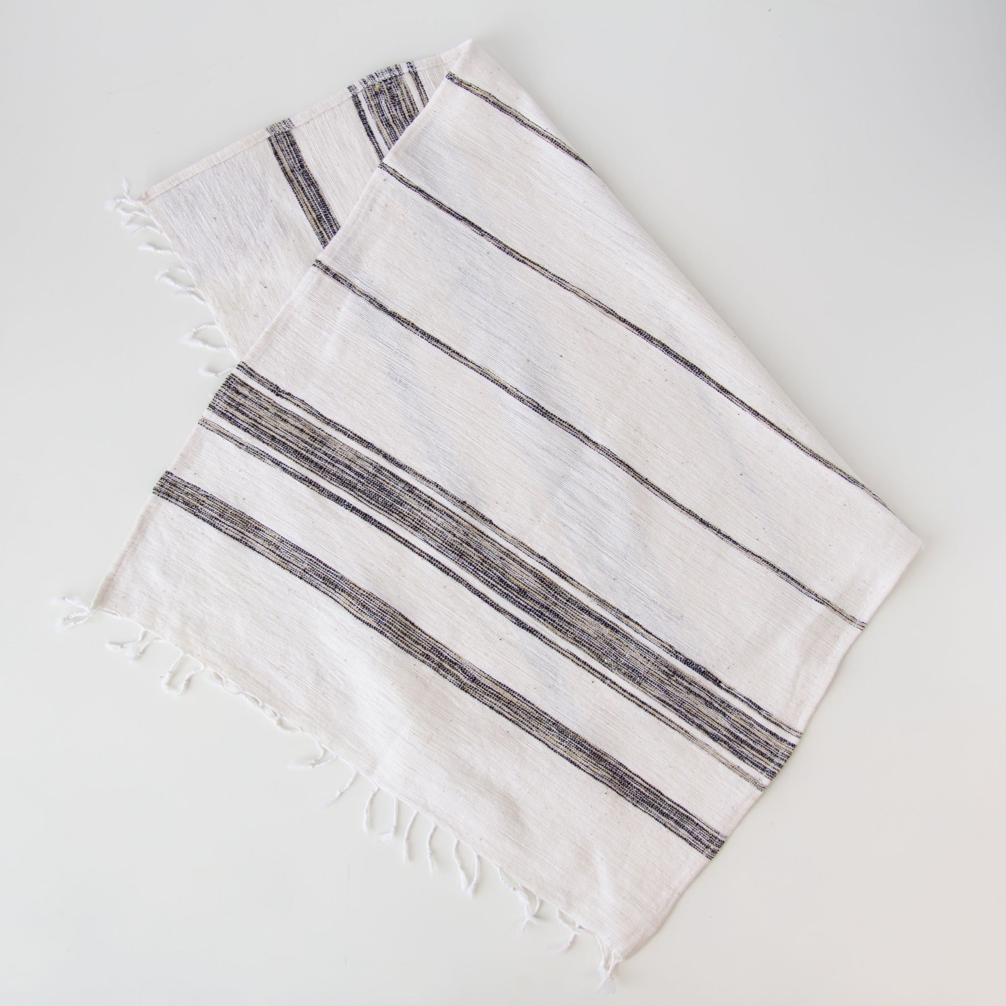 Ethiopian Woven Dish Towel - hand-crafted in Ethiopia using African fabrics and materials for a fair trade Etched Leaf Earrings- made for a fair trade social enterprise