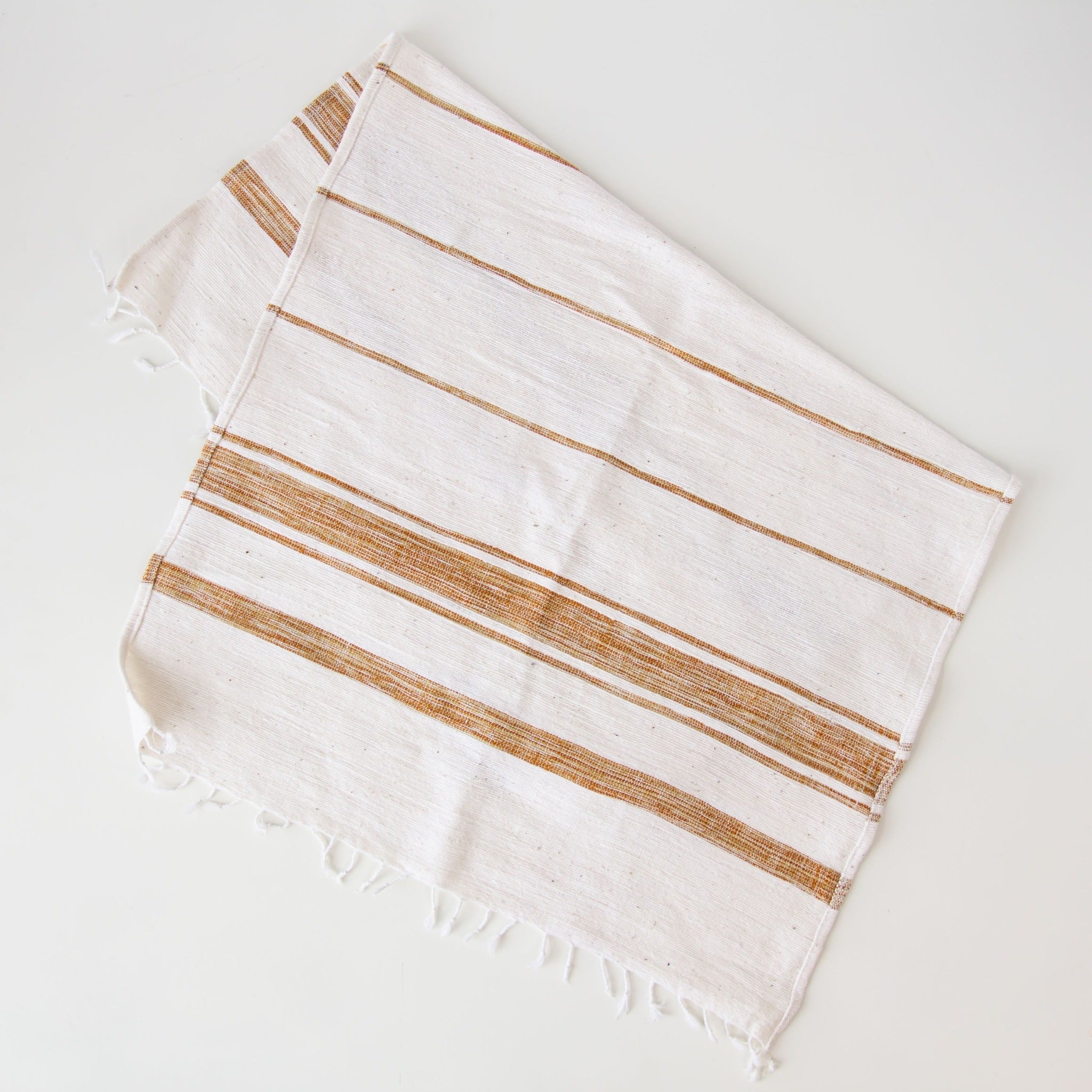 Ethiopian Woven Dish Towel - hand-crafted in Ethiopia using African fabrics and materials for a fair trade Etched Leaf Earrings- made for a fair trade social enterprise