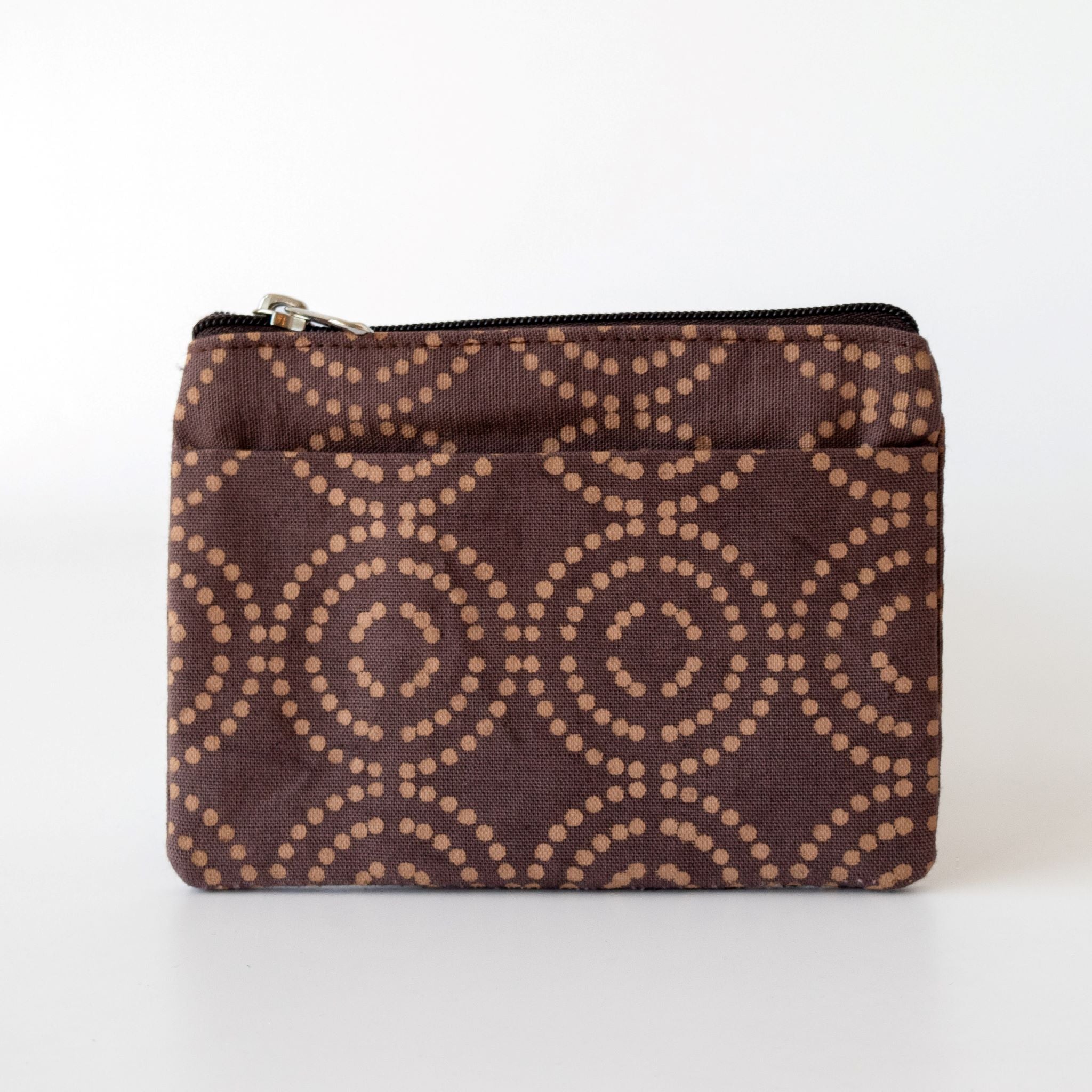 Mulberry colored coin purse with a dotted circle pattern on a white background.