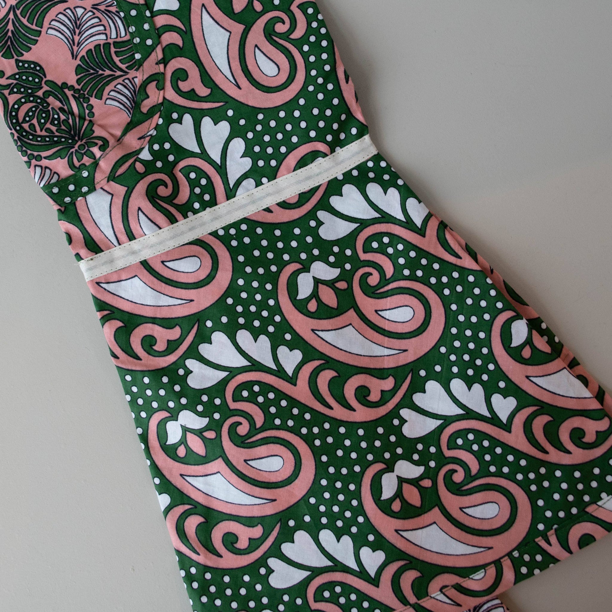 Kanga apron handmade by the women of Amani ya Juu in Kenya for a fair trade social enterprise