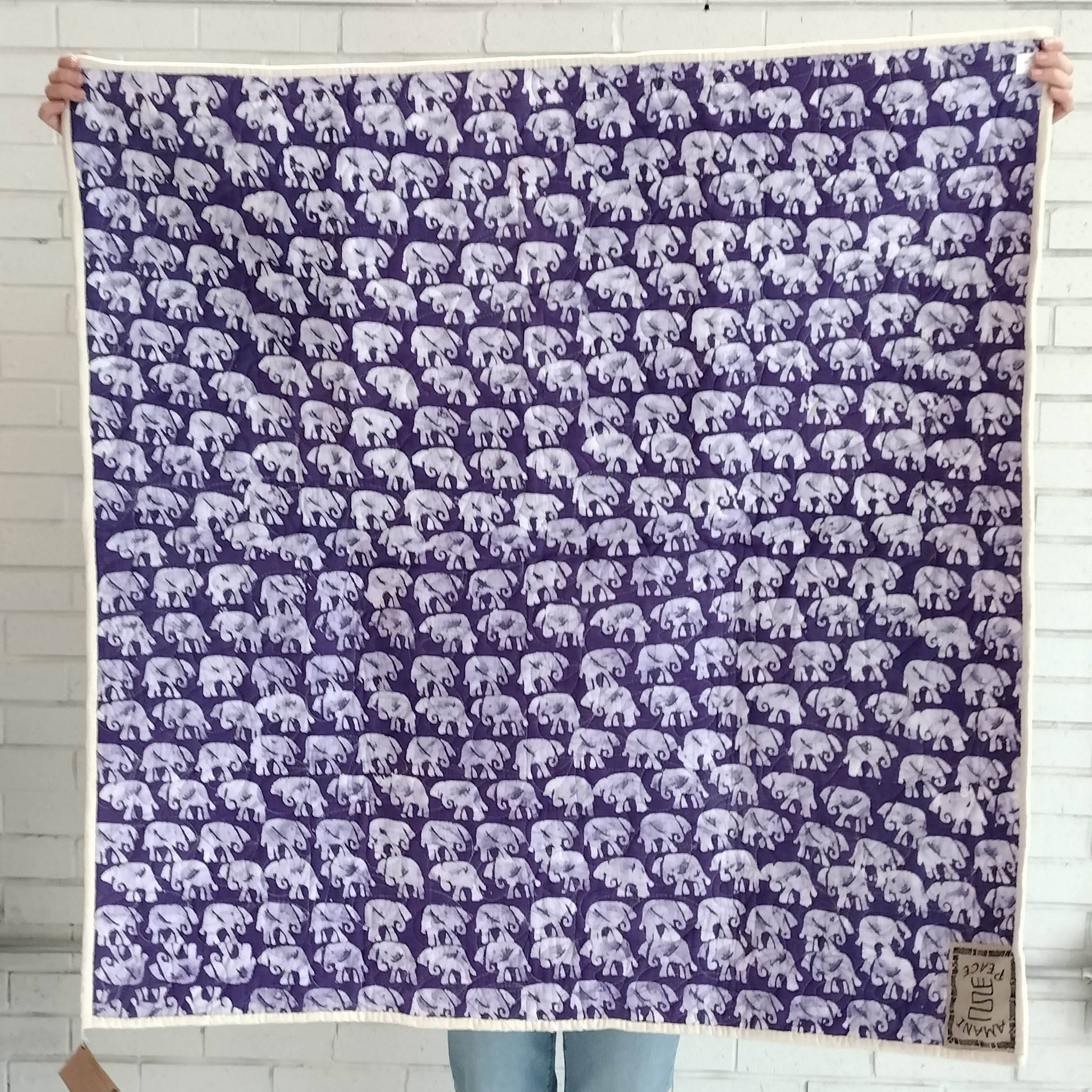 Hand stitched, hand dyed fabrics pieced together for an Amani ya Juu baby quilt