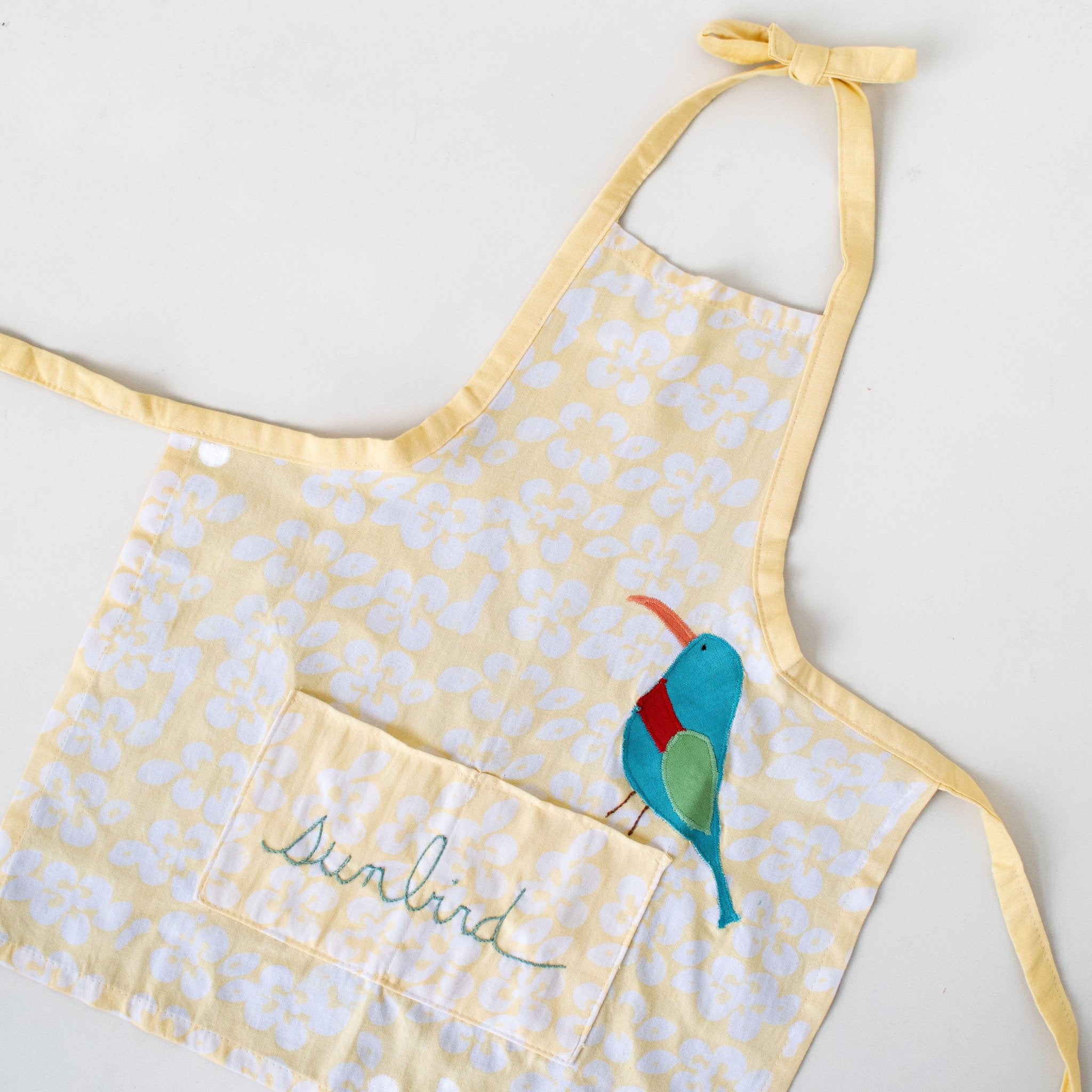 Watoto play apron - Original batik design handmade by the women of Amani ya Juu a Fair Trade social enterprise