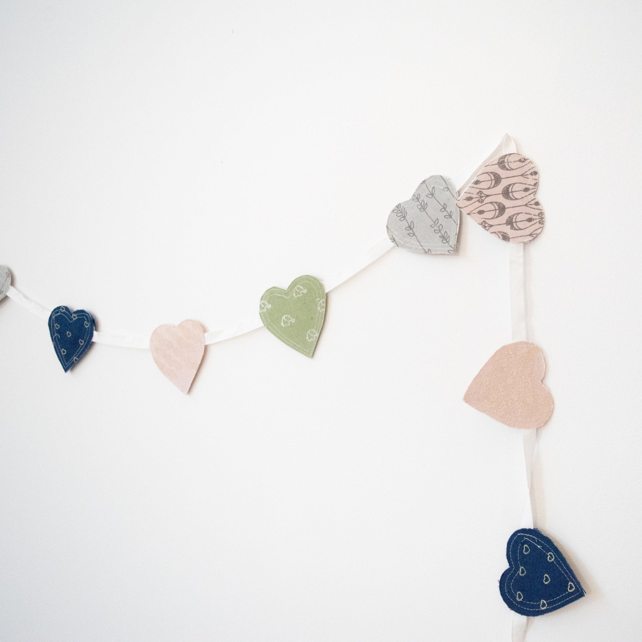 Screen printed hearts strung together on a ribbon from Amani ya Juu Kenya, a fair trade organization employing women in Africa