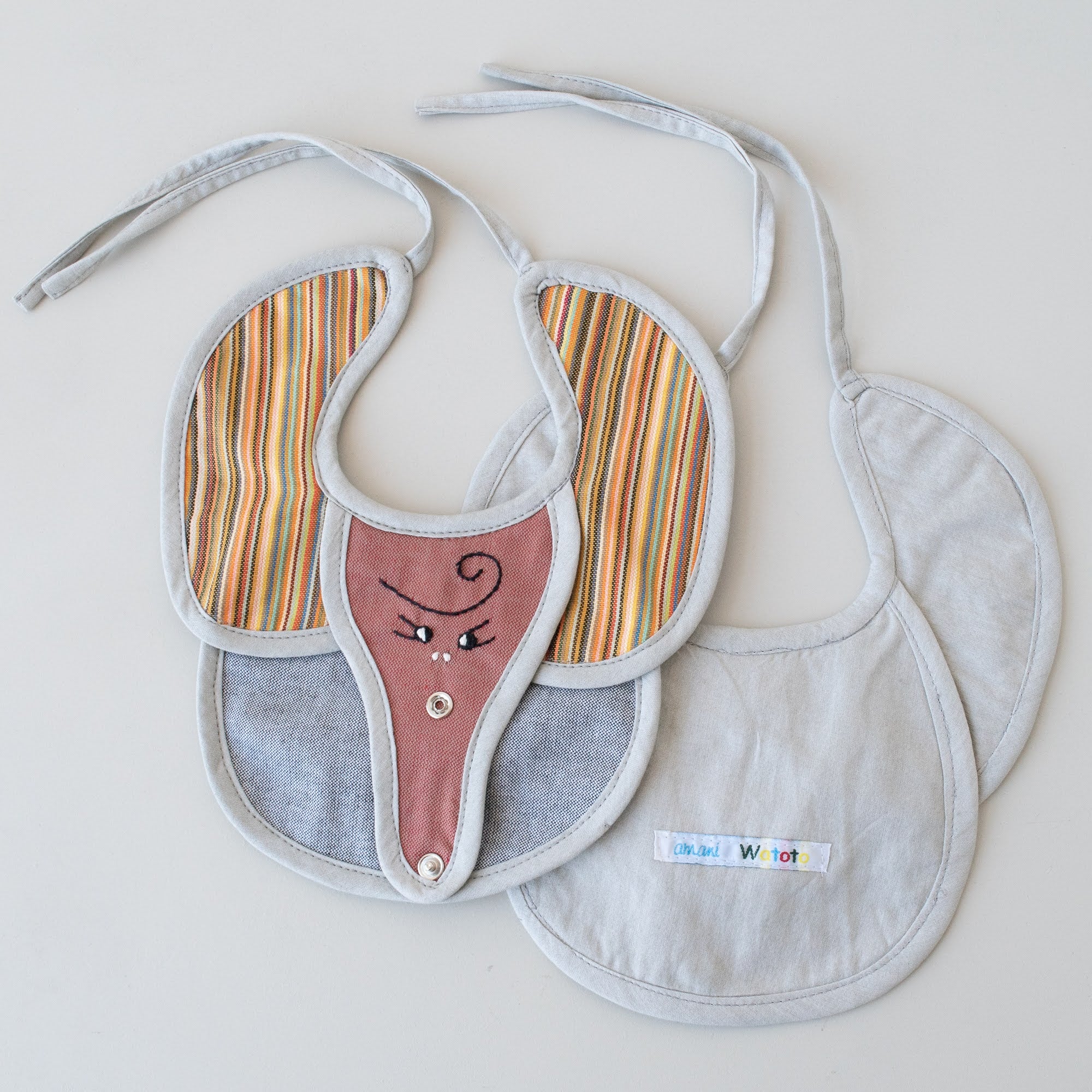 Elephant baby bib hand made from kikoy and other African fabrics by refugee women in Kenya