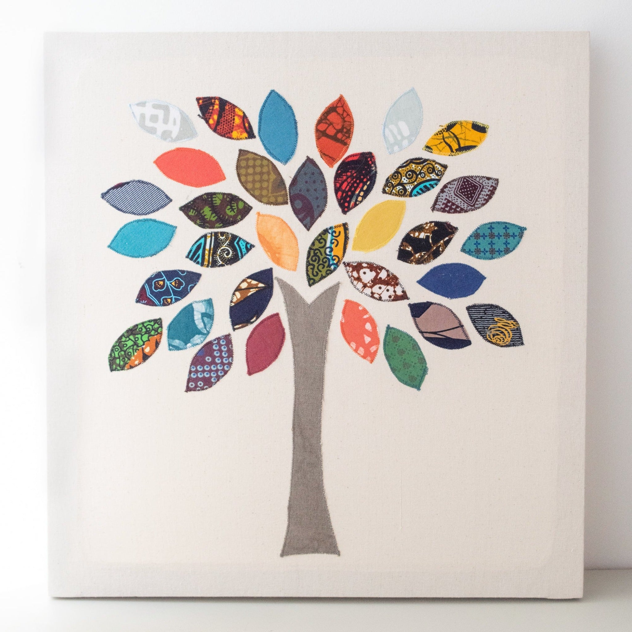 Family Tree Wall Hanging - kitenge appliqued on white cotton fabric by Amani ya Juu Kenya