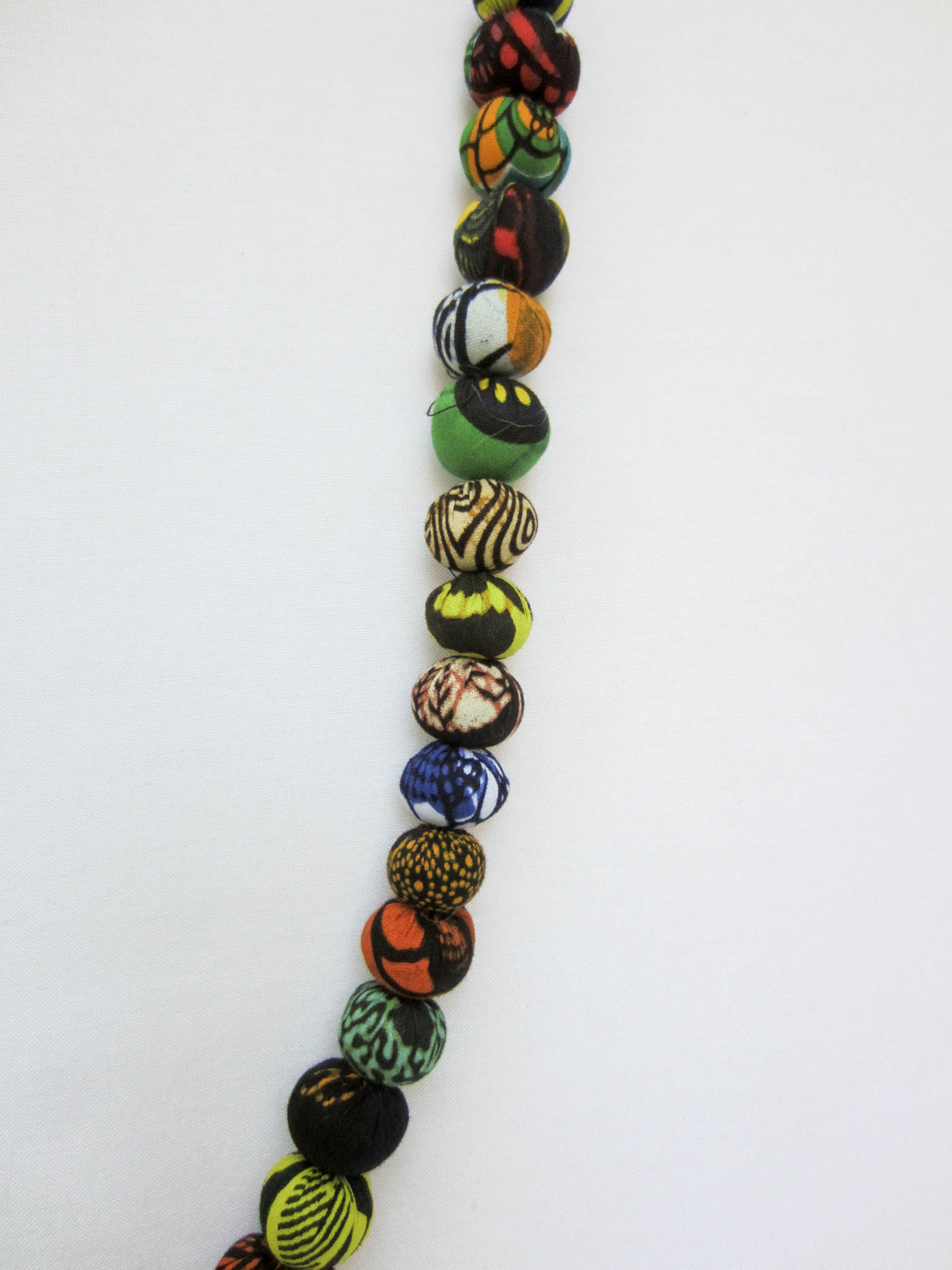 Kitenge ball garland - handmade using local kitenge fabric by the Amani women of Uganda for a fair trade social enterprise