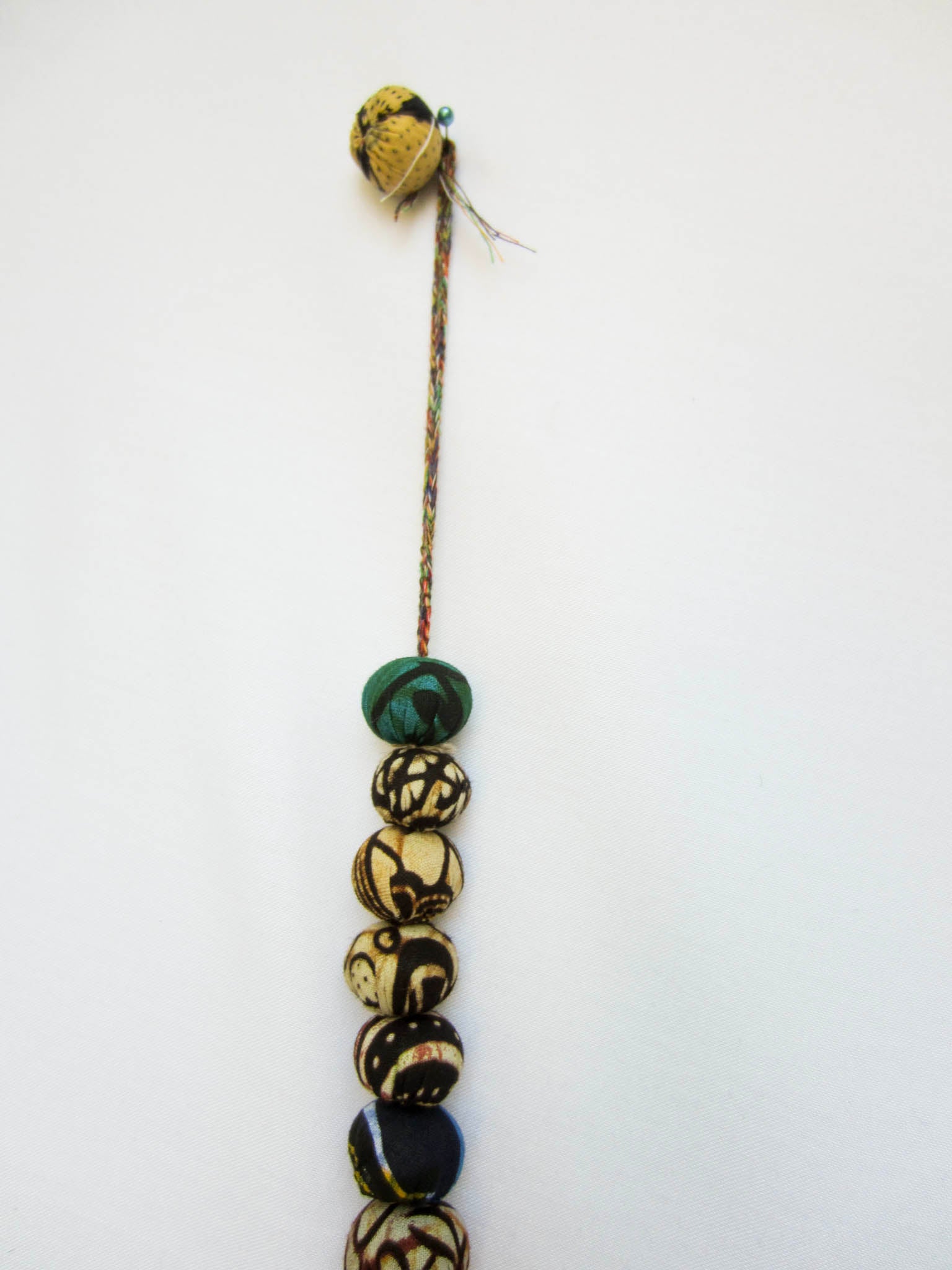 Kitenge ball garland - handmade using local kitenge fabric by the Amani women of Uganda for a fair trade social enterprise