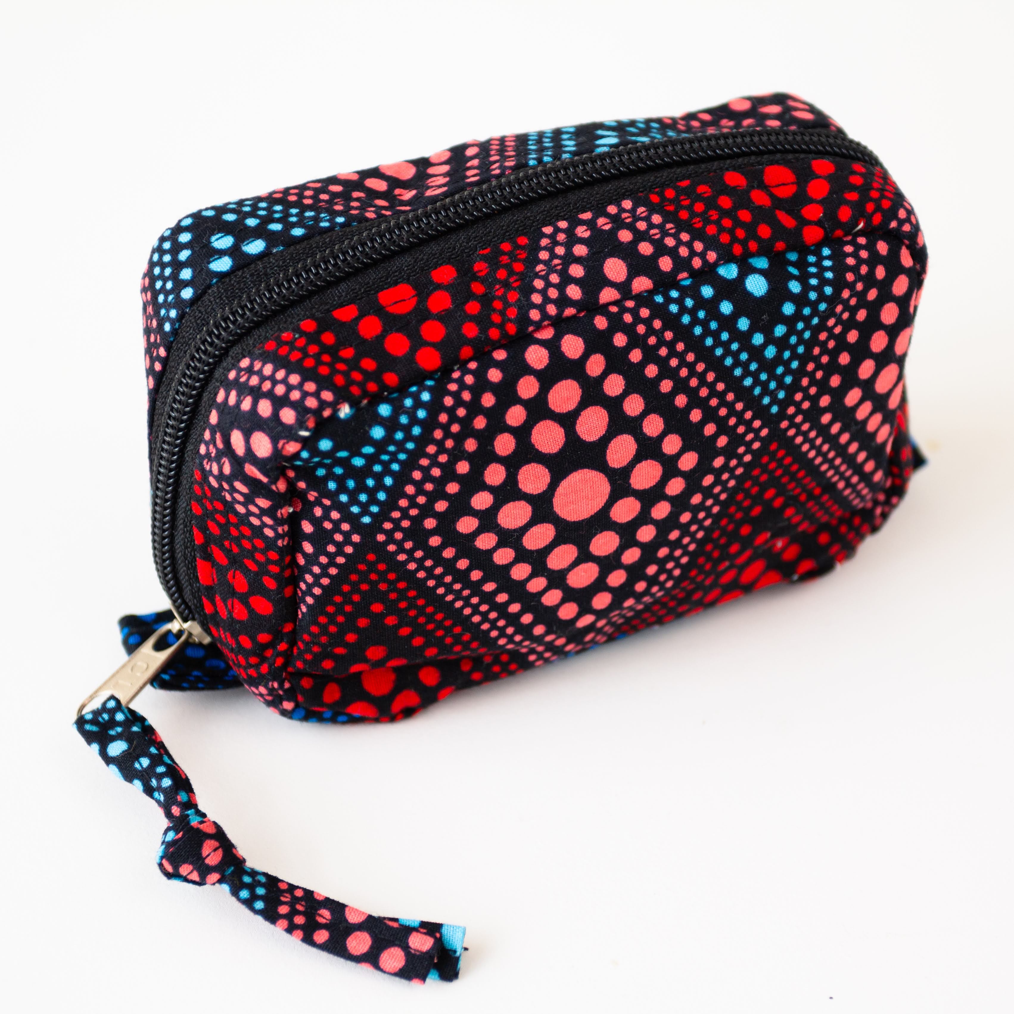 Amani ya Juu Uganda, a fair trade organization, kitenge mini travel case made by refugee women