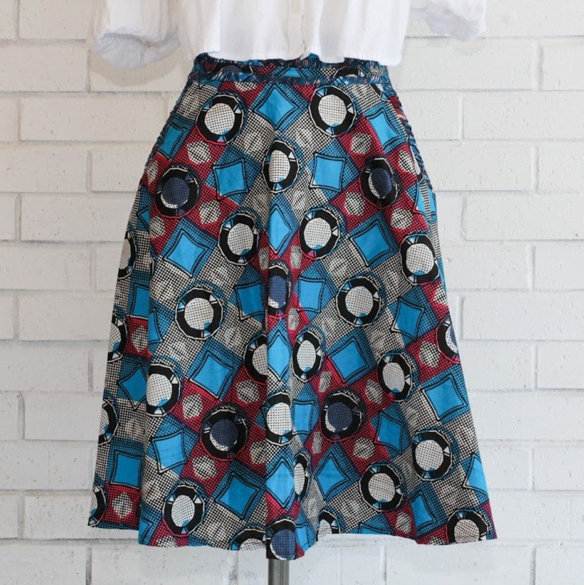 One-of-a-kind handmade kitenge skirt fashioned by refugee women in East Africa for a fair trade social enterprise