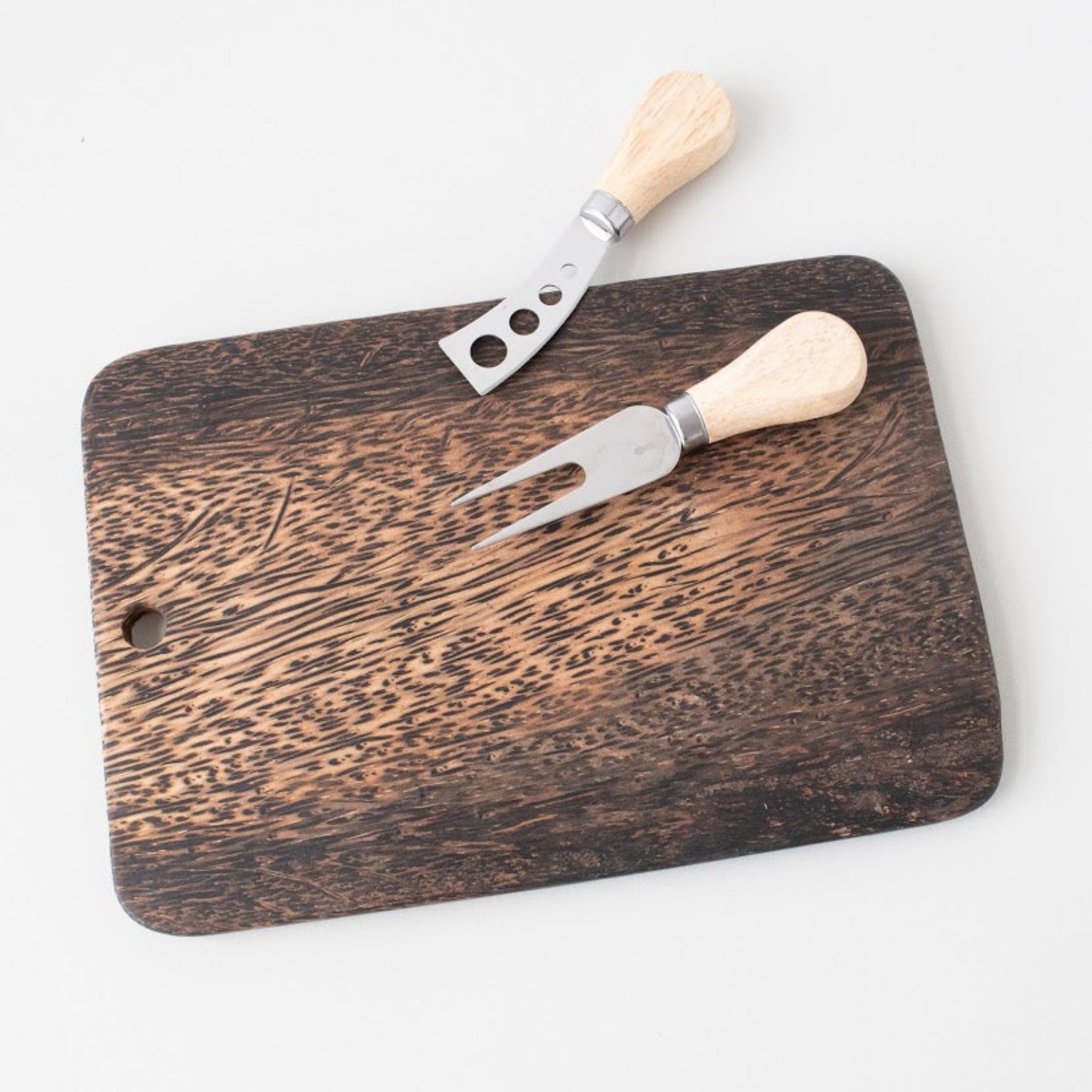 Palm Wood Cutting Board with cheese servers on a white background.