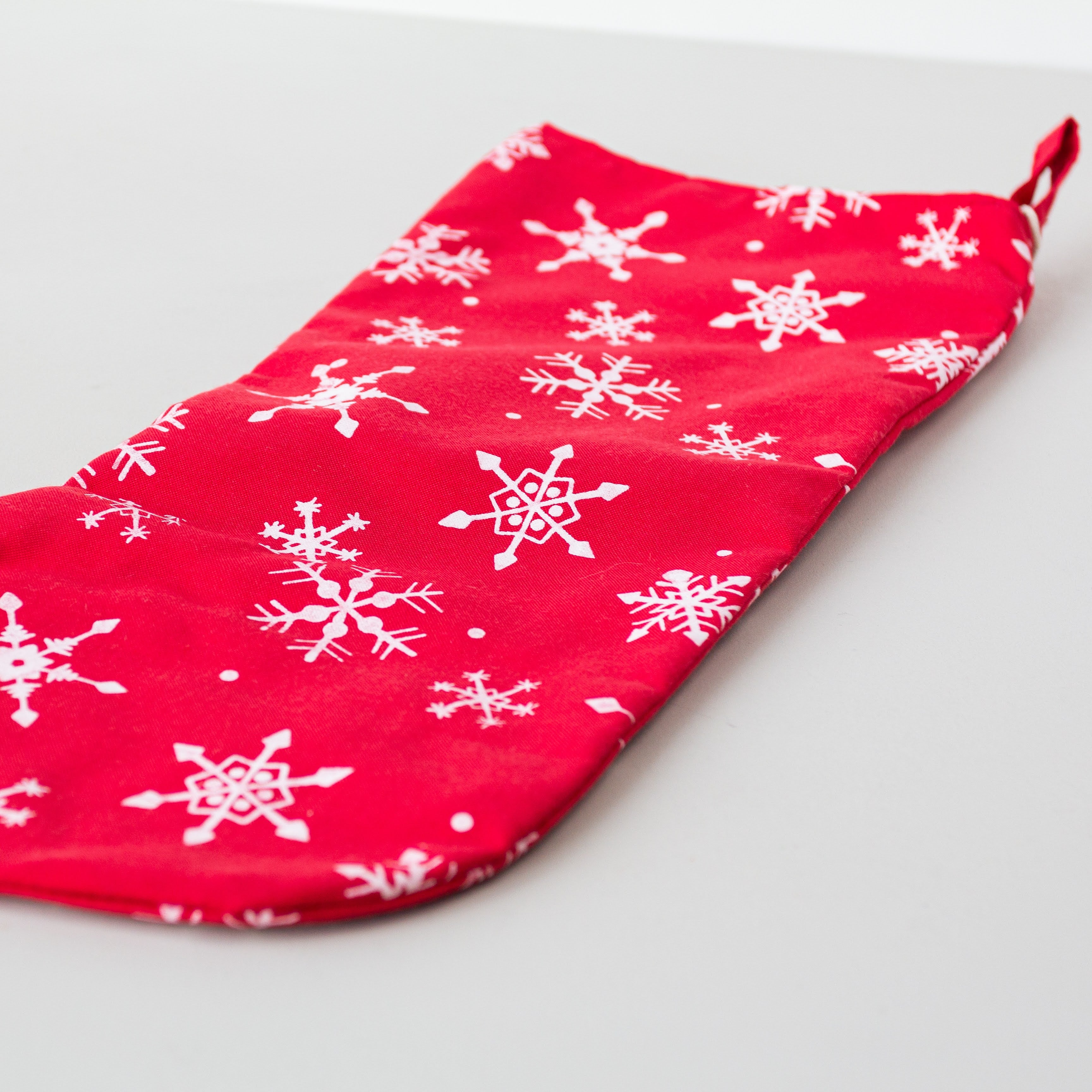 Snowflake Stocking - handmade using Kenyan materials by the women of Amani for a Fair Trade social enterprise