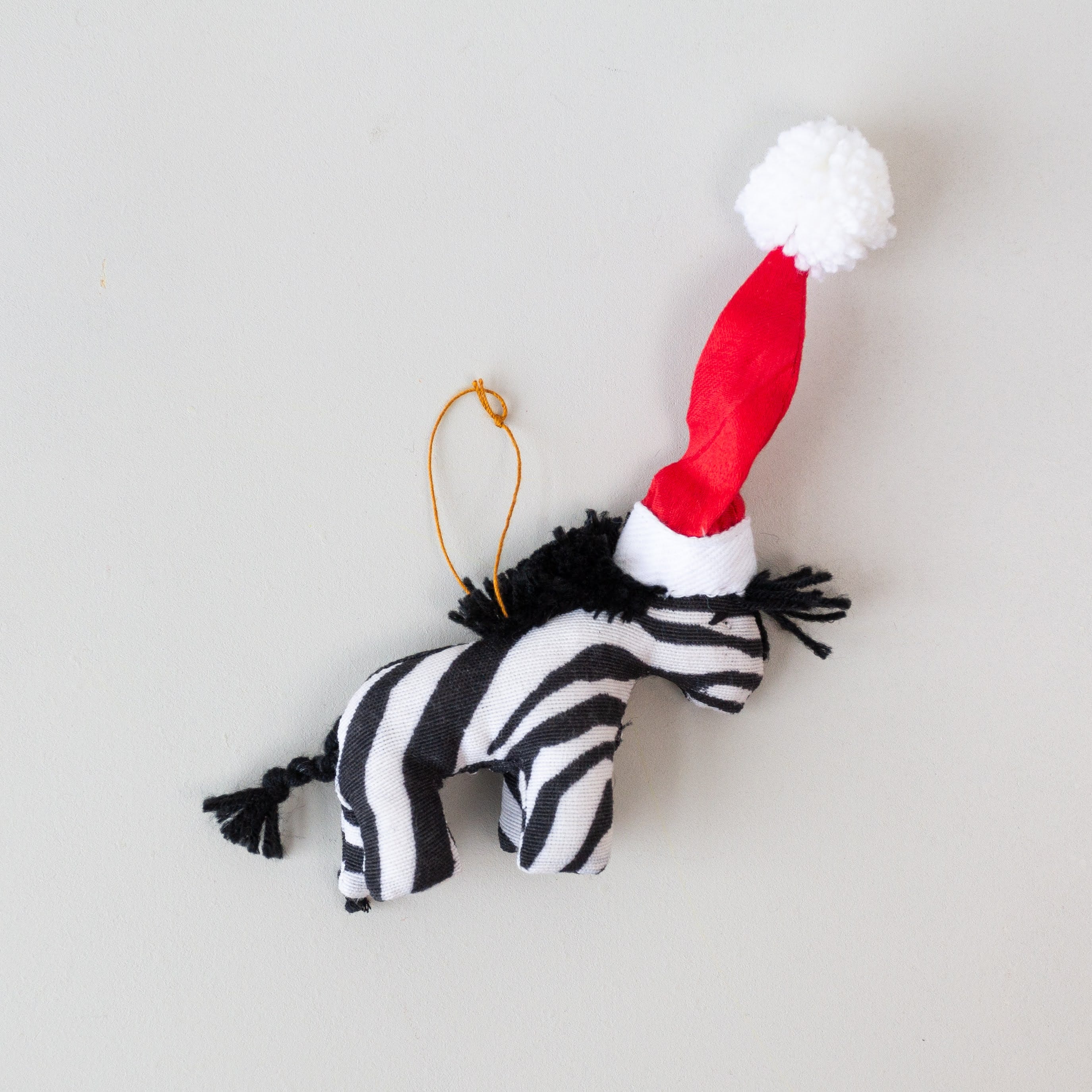 Jolly Zebra Ornament - handmade by the women of Amani using Kenyan materials for a Fair Trade social enterprise