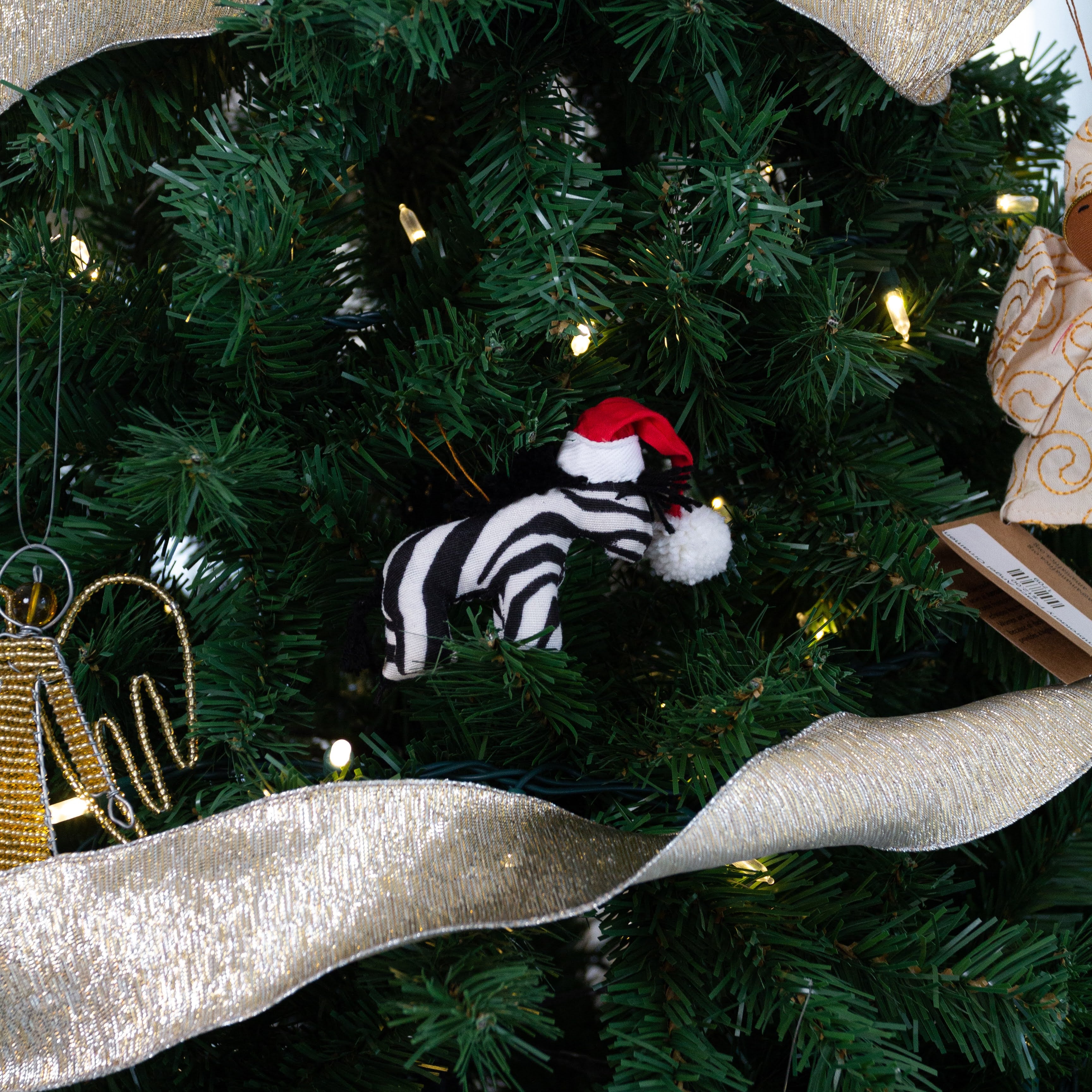 Jolly Zebra Ornament - handmade by the women of Amani using Kenyan materials for a Fair Trade social enterprise