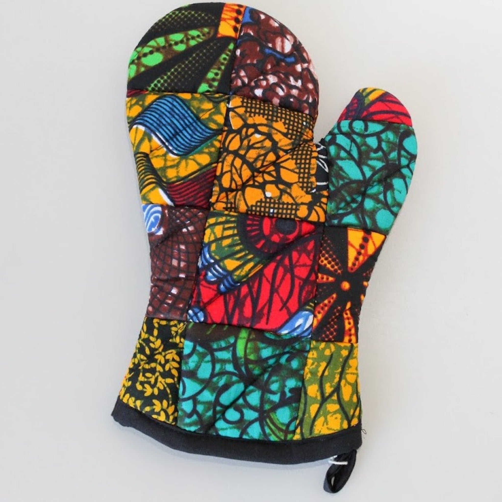 Original patch oven mitts - Quilted patchwork made from local East African fabrics handmade by the women of Amani Uganda for a fair trade social enterprise