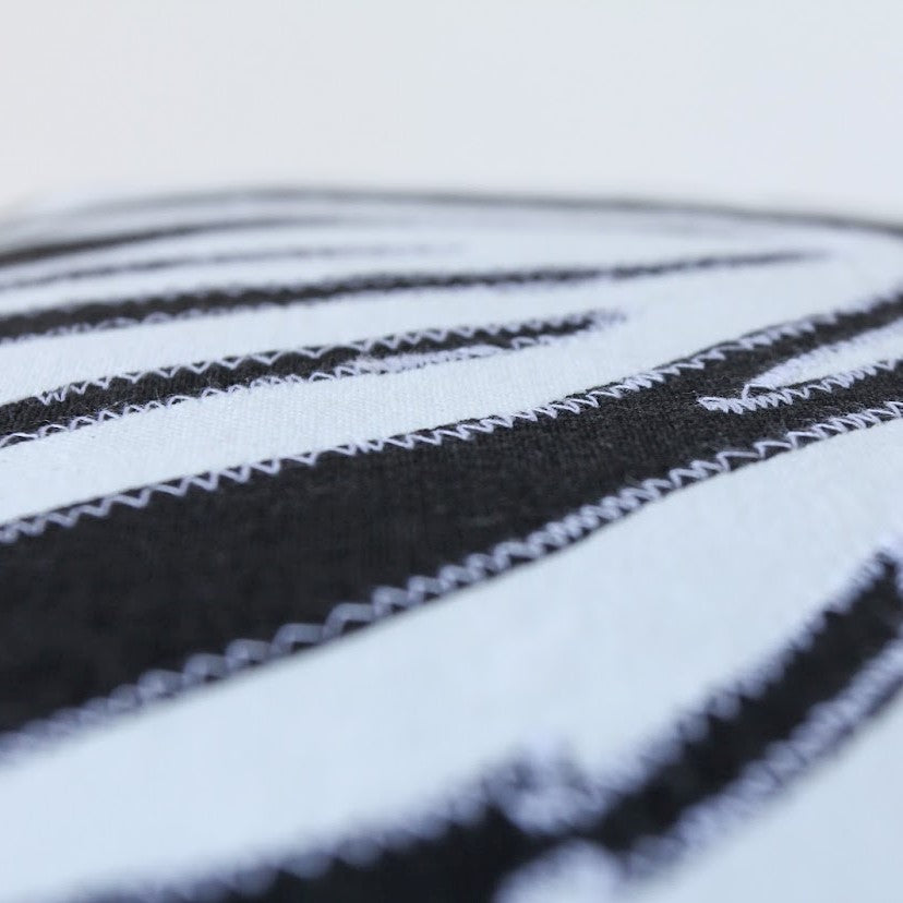Fair trade zebra patterned pillow case handmade by the women of Amani ya Juu in Kenya for a social enterprise