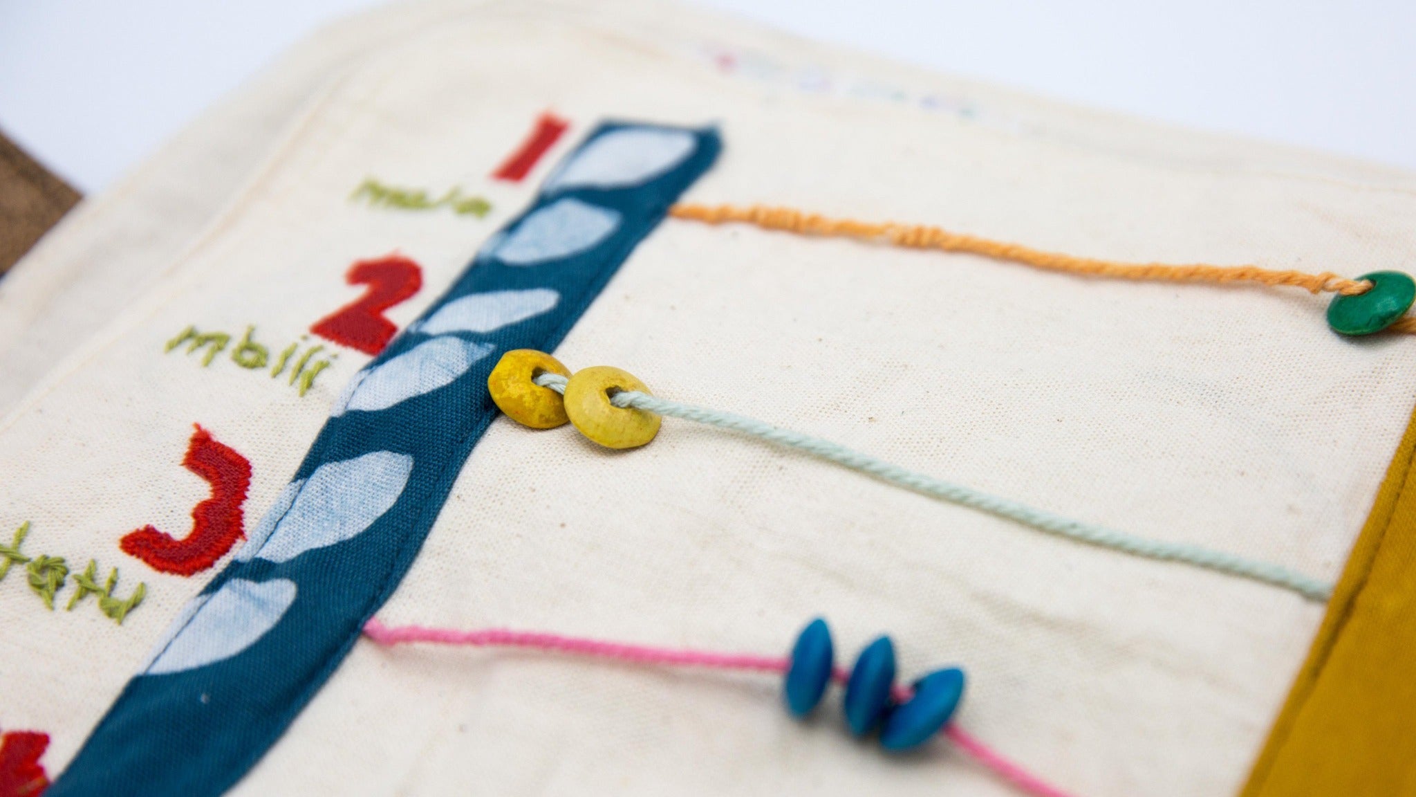 Busy Book - Kenyan materials and design for a fair trade boutique