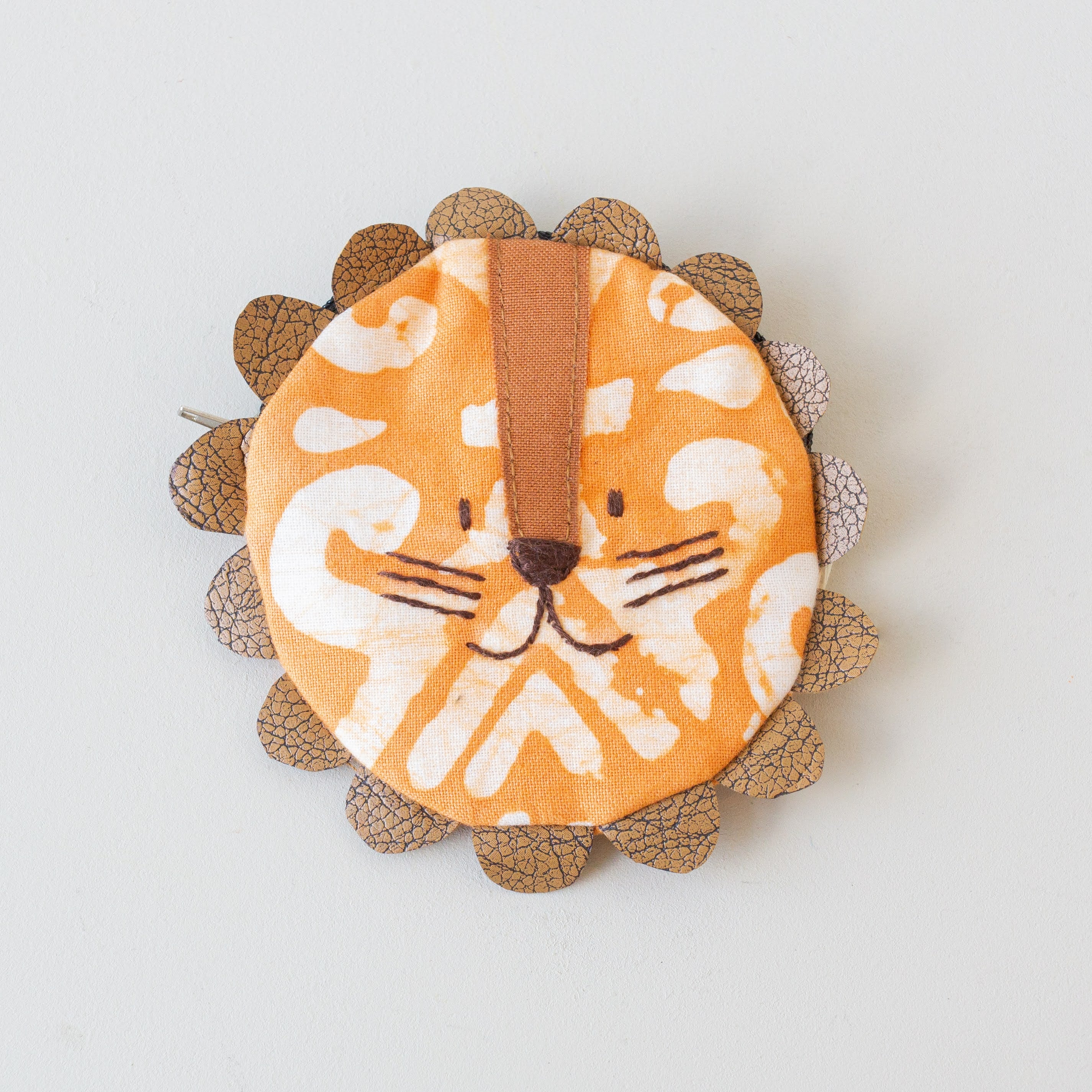 Children's Coin Pouch - handmade using orange batik fabric by the women of Amani in Kenya for a Fair Trade social enterprise