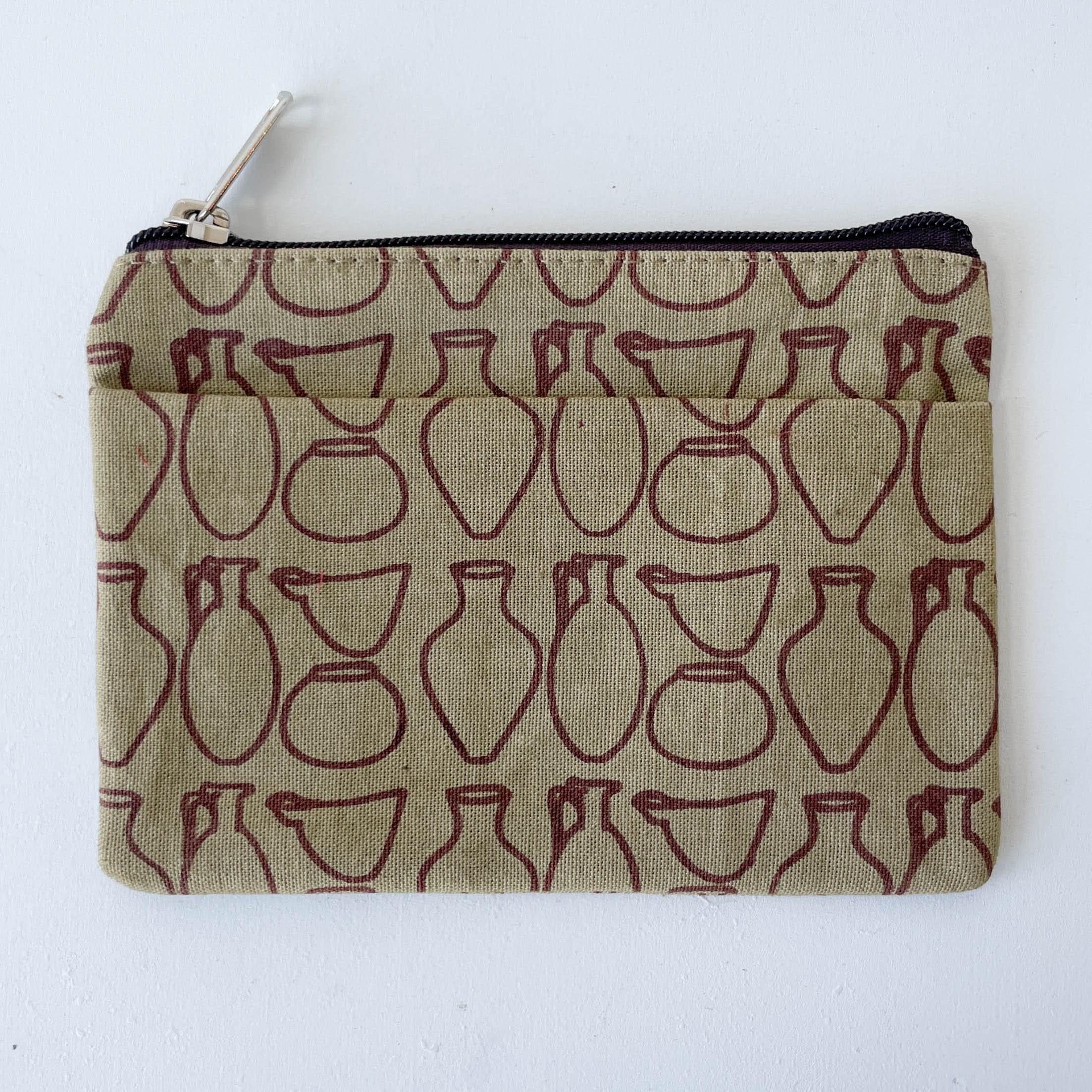Pouch with red vase pattern on beige background