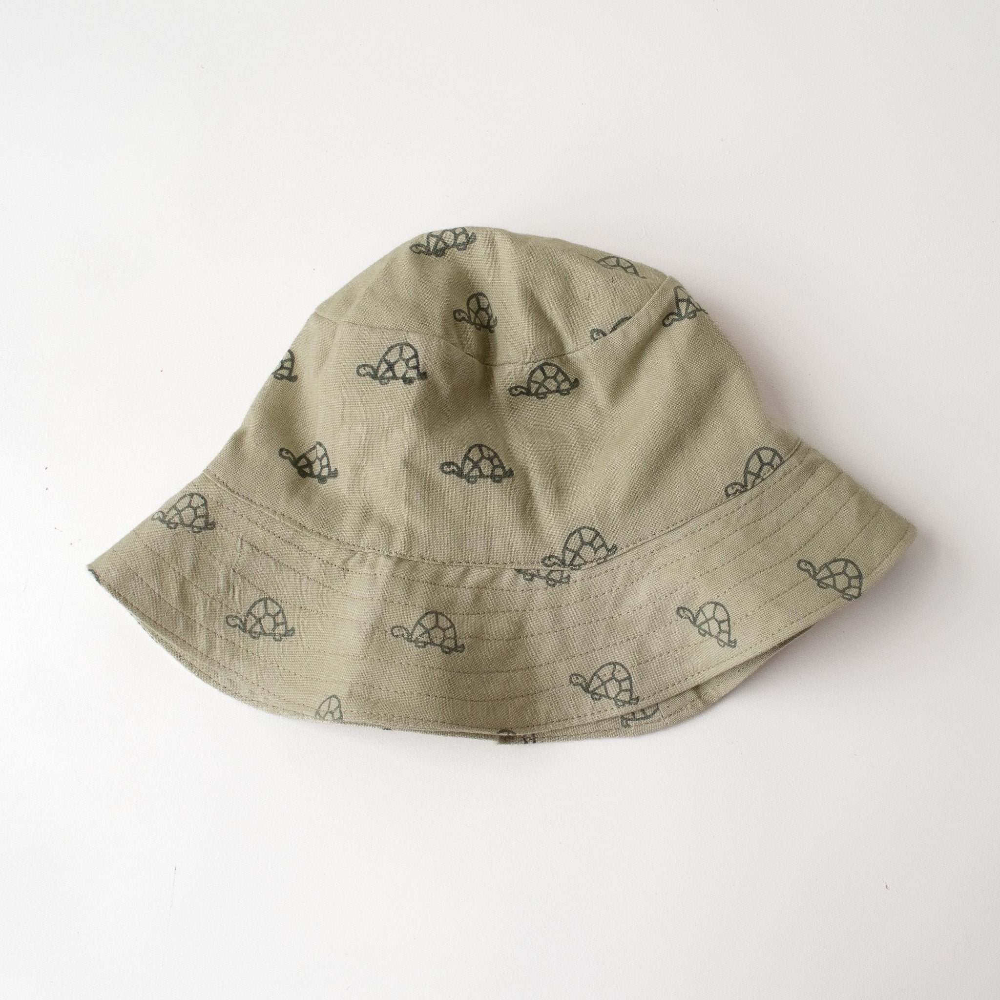 baby bucket hat green with screen printed turtles