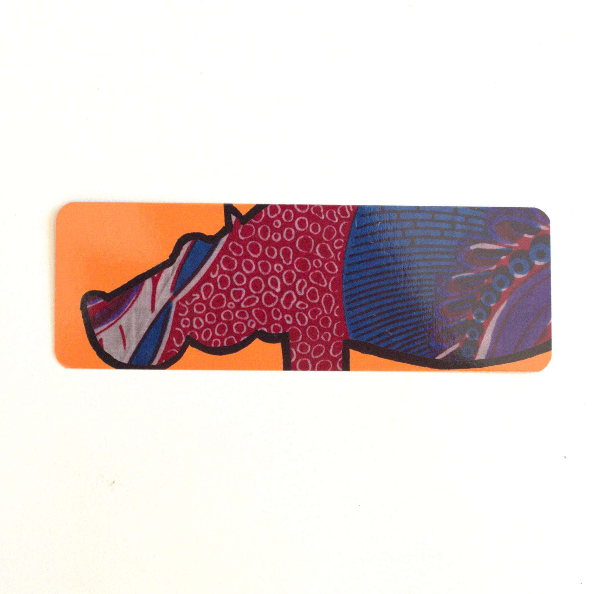 Colorful hippo bookmark with abstract design on an orange background