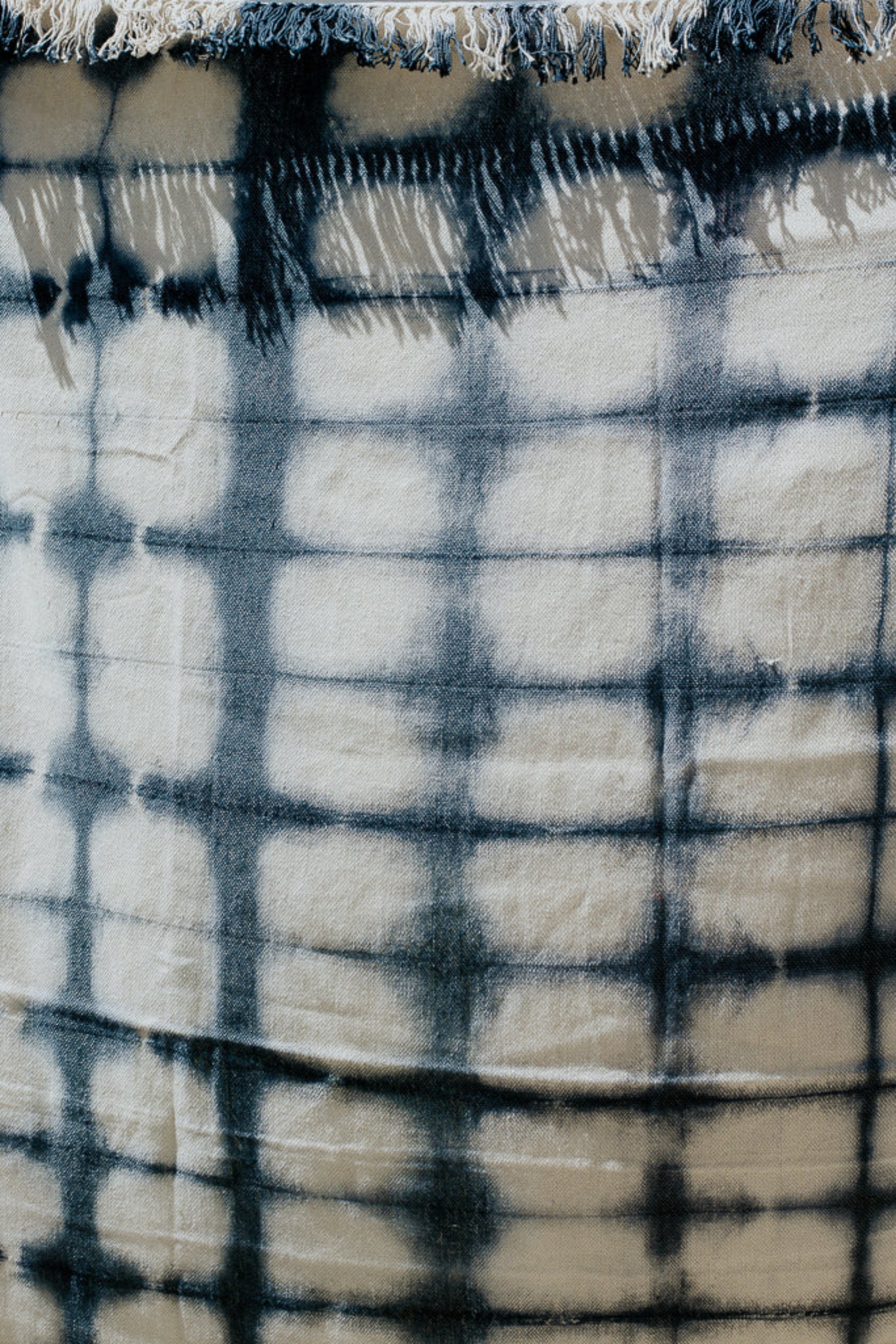 Textured fabric with blue and white checkered pattern