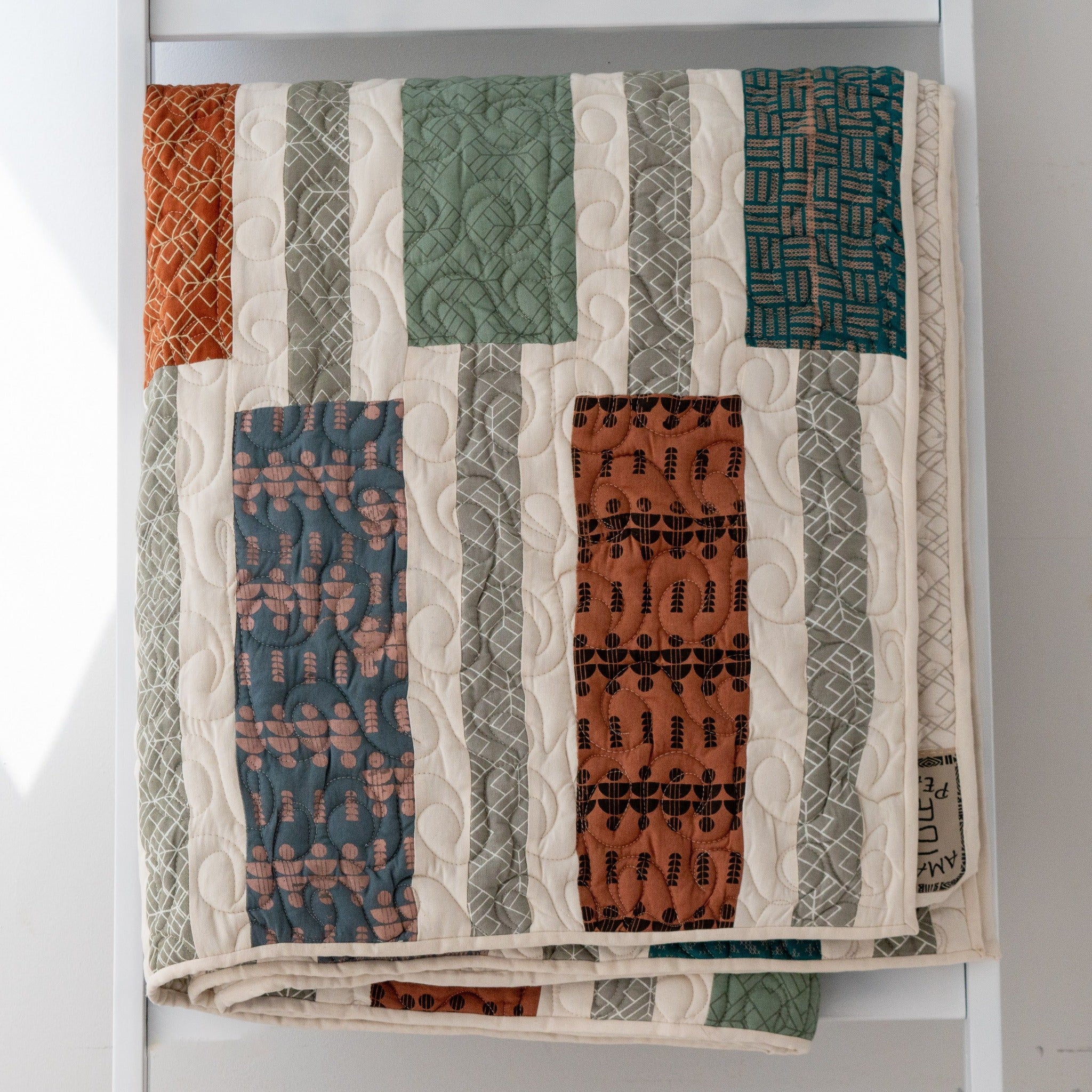 An Amani quilt - handstitched by the women at Amani Kenya for a Fair Trade boutique