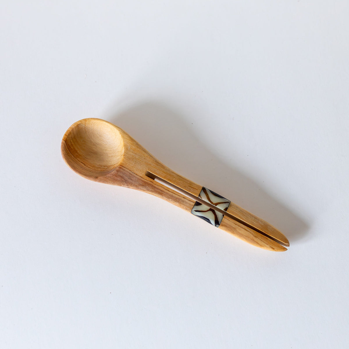 Olivewood spoon with split handle on white background
