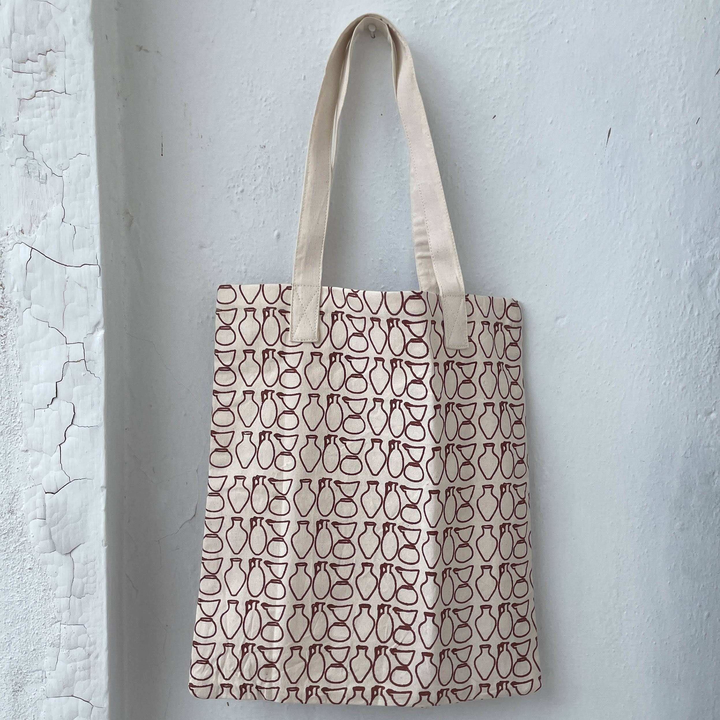 Tote bag with geometric pattern on a textured white background