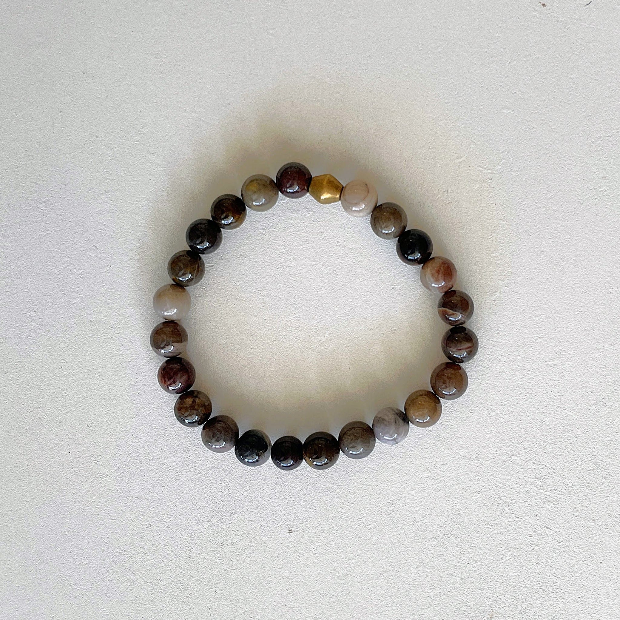 Beaded bracelet with multicolored beads on a white background