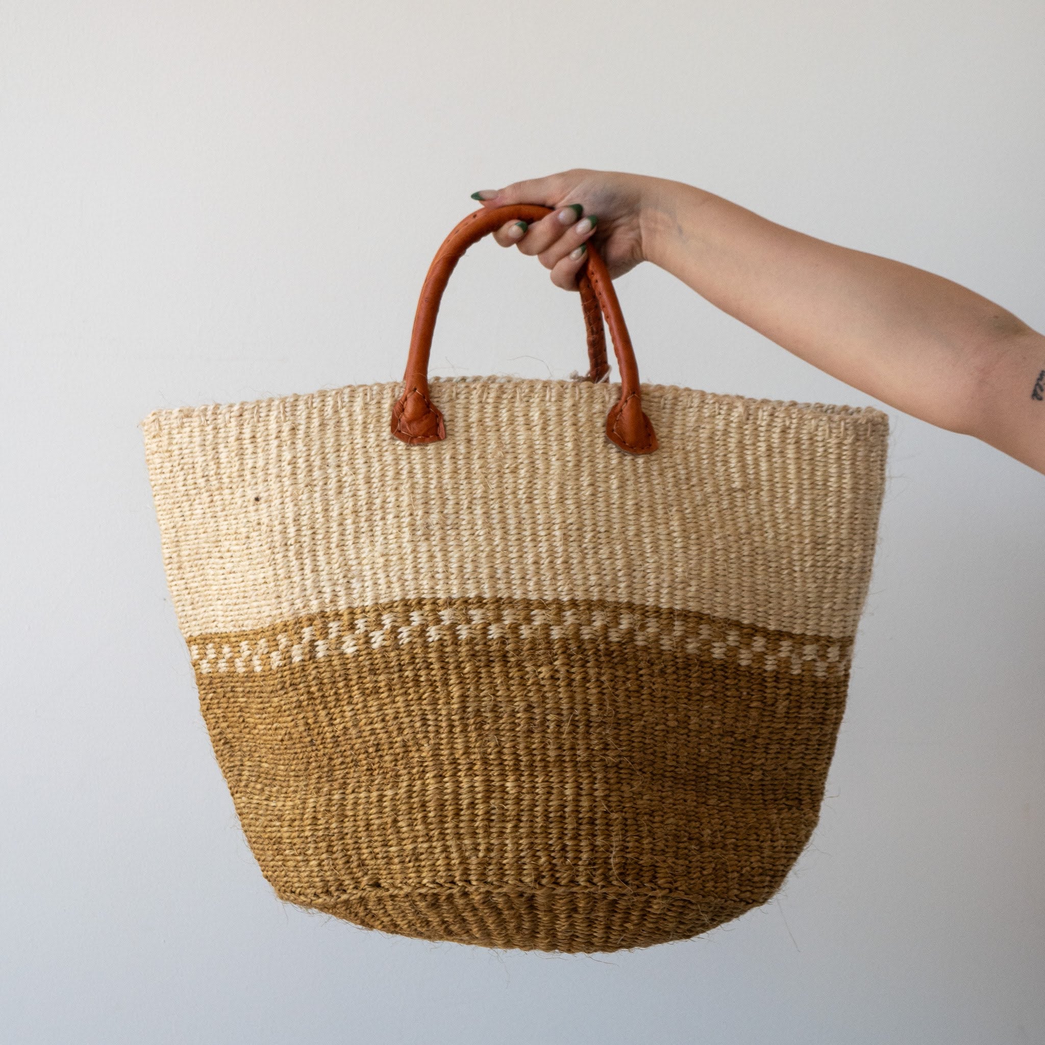 A Fair Trade handwoven sisal basket made by Kenyan artisans